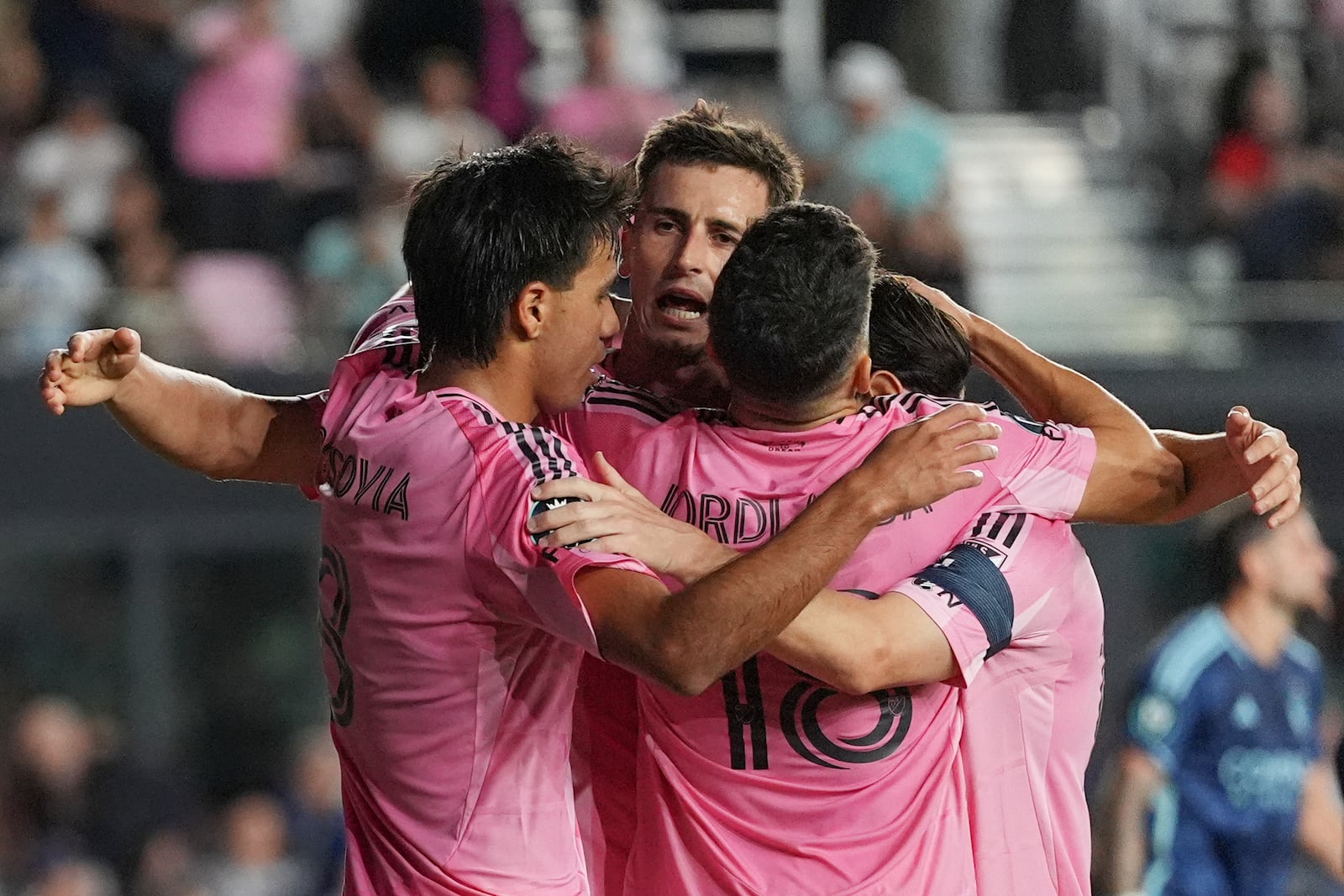 Inter Miami forward Tadeo Allende, center, celebrates with teammates after scoring his side's second goal against Sporting Kansas City, in the first half of a CONCACAF Champions Cup soccer match, Tuesday, Feb. 25, 2025, in Fort Lauderdale, Fla. (AP Photo/Rebecca Blackwell)