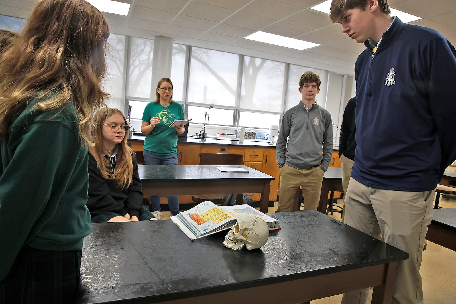 Kelly Brown teaches a chemistry class at Catholic Central High School Tuesday, March 5, 2024. BILL LACKEY/STAFF