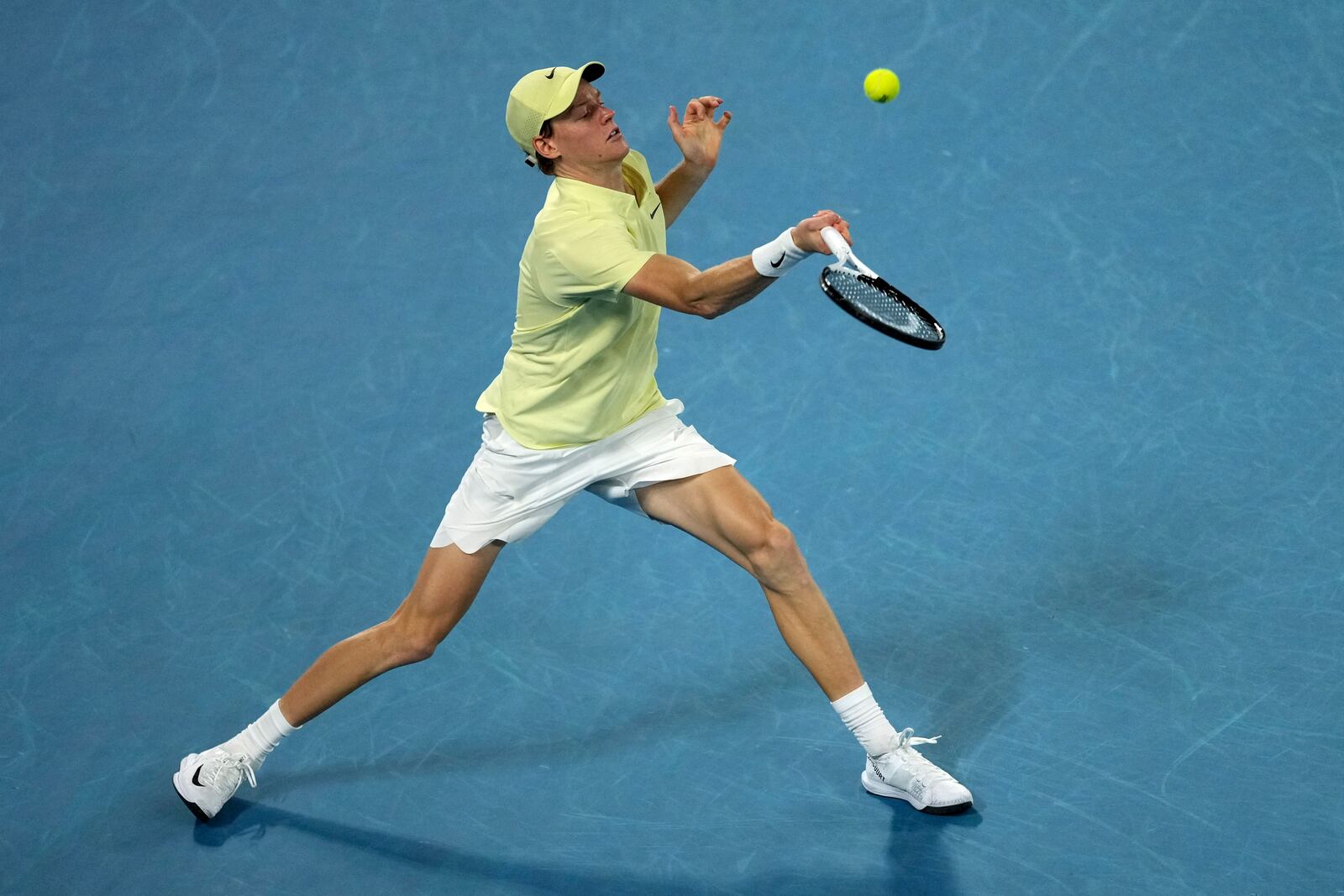 Jannik Sinner of Italy plays a forehand return to Alexander Zverev of Germany in the men's singles final at the Australian Open tennis championship in Melbourne, Australia, Sunday, Jan. 26, 2025. (AP Photo/Mark Baker)