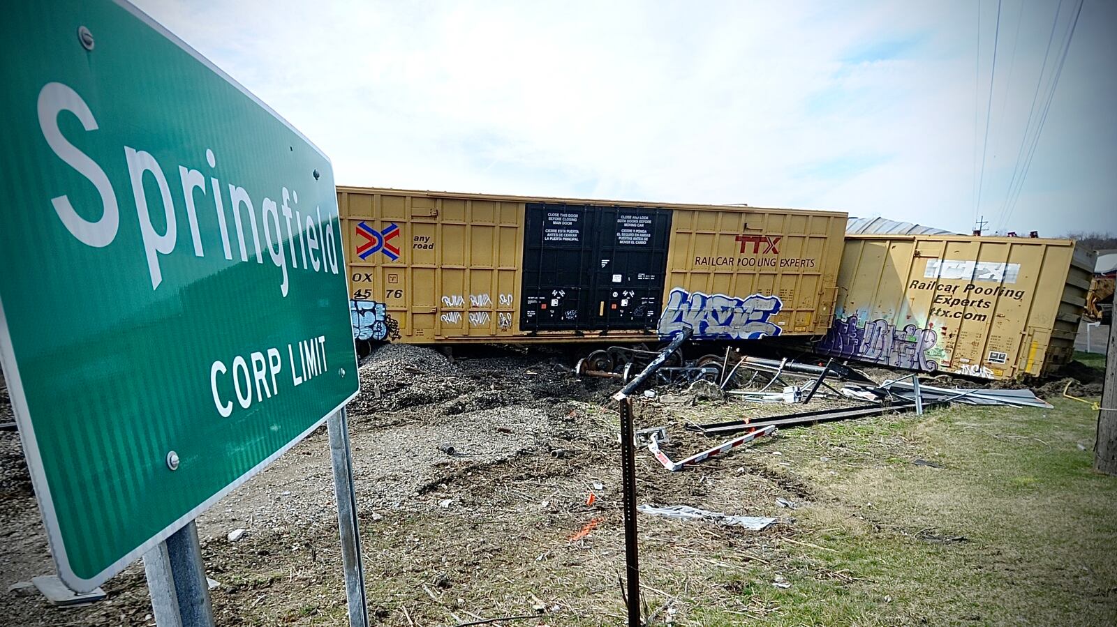 Cleanup crews work to remove the rail cars from a Norfolk Southern train derailment along Ohio 41 near the Clark county fairgrounds Sunday morning March 5, 2023. MARSHALL GORBY \STAFF