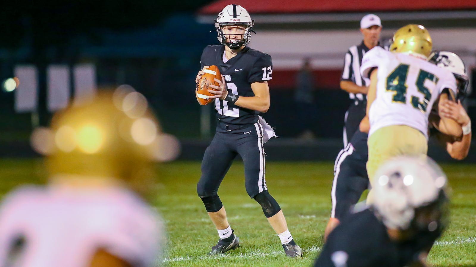 Greenon High School junior Kaden Wooten stands in the pocket during their game against Catholic Central on Friday night at Greenon Stadium in Springfield. Wooten scored on a 37-yard run late in the fourth quarter to lift the Knights to a 10-6 victory. CONTRIBUTED PHOTO BY MICHAEL COOPER