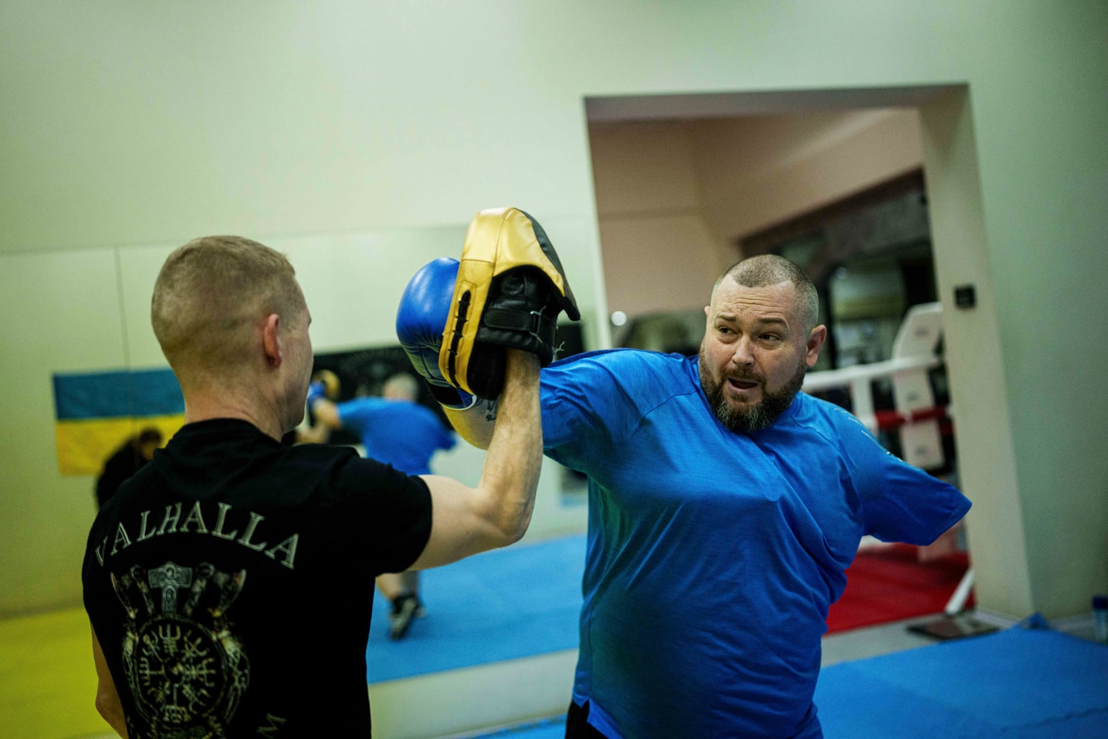 Oleksandr Puzikov, a captain with Ukraine's 127th brigade who lost an arm in a Russian mortar attack, trains at a gym in Kharkiv, Ukraine, on Feb. 10, 2025. (AP Photo/Evgeniy Maloletka)