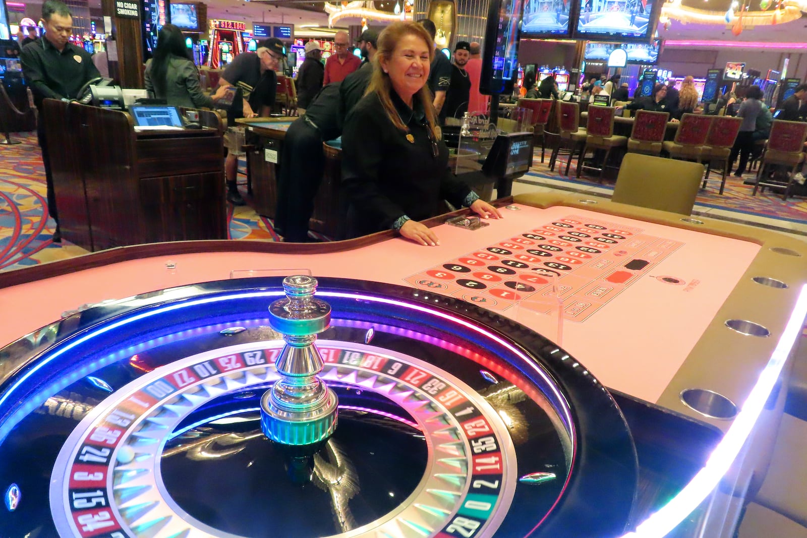 A dealer waits for customers at a roulette table at the Hard Rock casino in Atlantic City, N.J., on Oct. 3, 2024, a month in which internet gambling set a new revenue record in New Jersey at $213 million. (AP Photo/Wayne Parry)