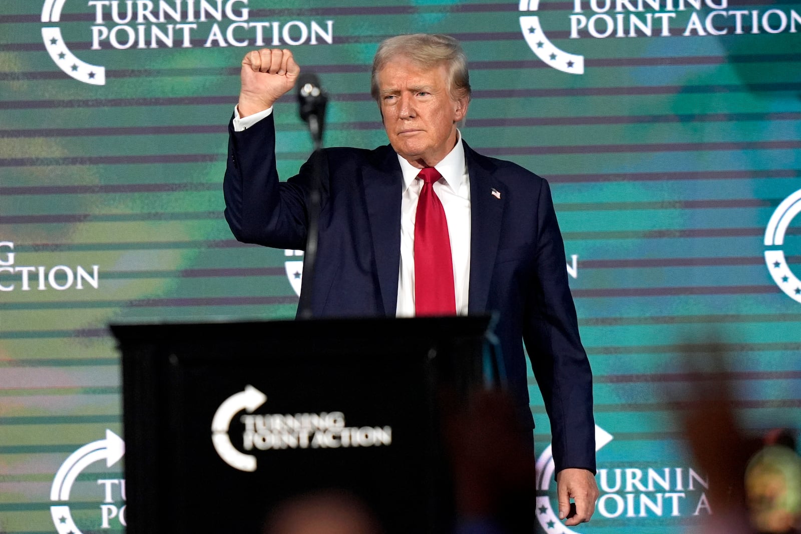 FILE - Republican presidential candidate former President Donald Trump gestures as he finishes speaking at The Believers' Summit 2024 at a Turning Point Action event in West Palm Beach, Fla., July 26, 2024. (AP Photo/Lynne Sladky, File)