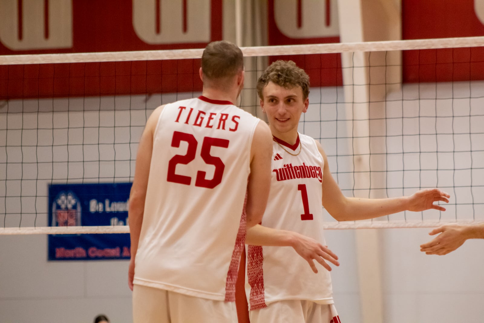 Wittenberg volleyball players Dominic Melchiorre, left, and Eli Halverson celebrate during a match in 2023. Photo courtesy of Wittenberg