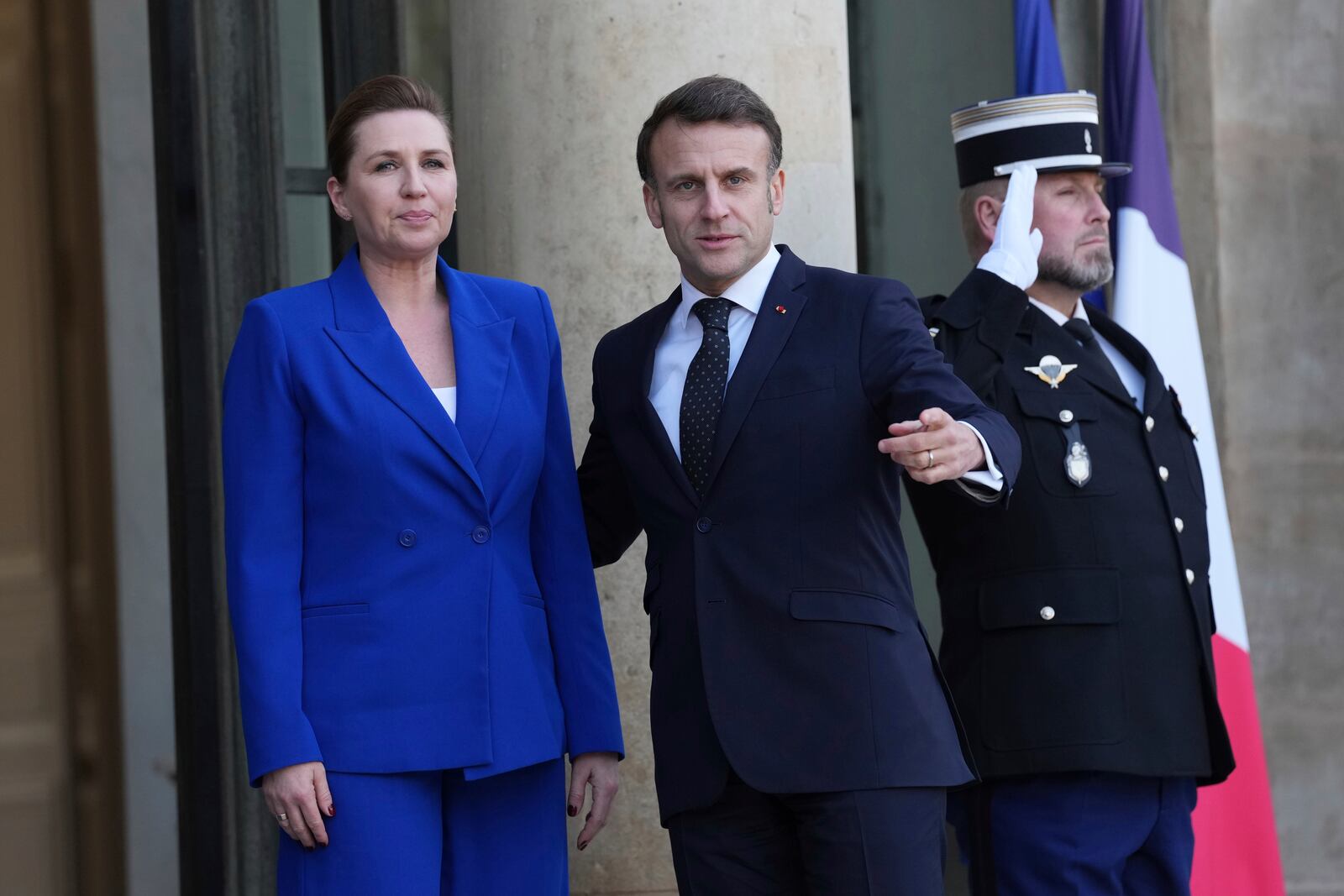 French President Emmanuel Macron, right, greets Denmark's Prime Minister Mette Frederiksen as she arrives for an informal meeting of leaders from key European Union nations and the United Kingdom at the Elysee Palace in Paris, Monday, Feb. 17, 2025. (AP Photo/Aurelien Morissard)