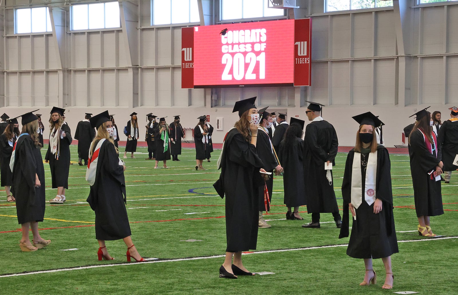 Wittenberg University held their 171 Commencement Ceremony Saturday at the school's Edwards-Maurer Stadium instead of the traditional Commencement Hollow.  To provide space for social distancing, the commencement was divided into two ceremonies and masks were worn by the graduates and their families. BILL LACKEY/STAFF