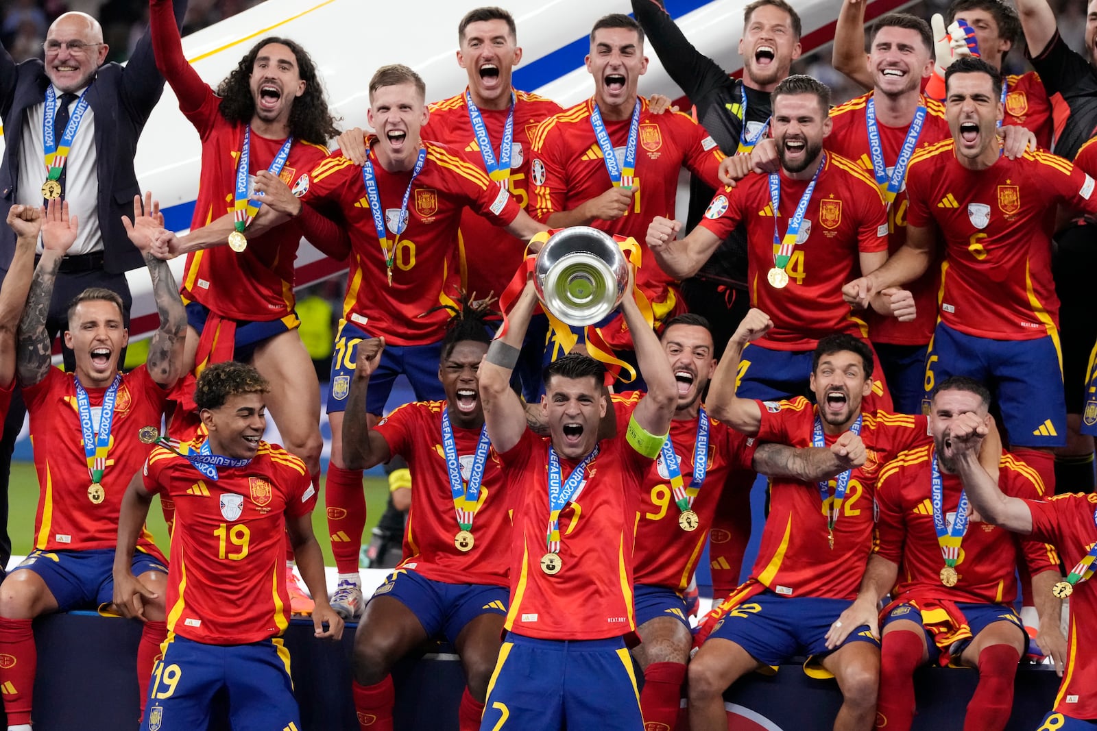 FILE - Spain's Alvaro Morata holds the trophy as he celebrates with his teammates after winning the final match between Spain and England at the Euro 2024 soccer tournament in Berlin, Germany, Sunday, July 14, 2024. Spain won 2-1. (AP Photo/Frank Augstein, File)