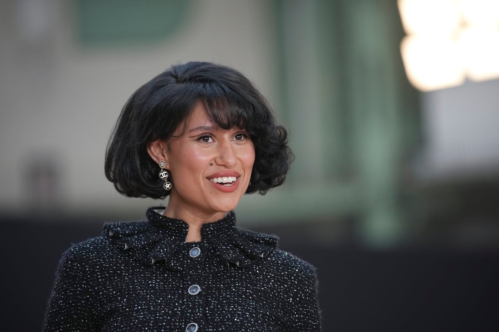 Raye arrives for the the Chanel Fall/Winter 2025-2026 Womenswear collection presented Tuesday, March 11, 2025. in Paris. (AP Photo/Christophe Ena).