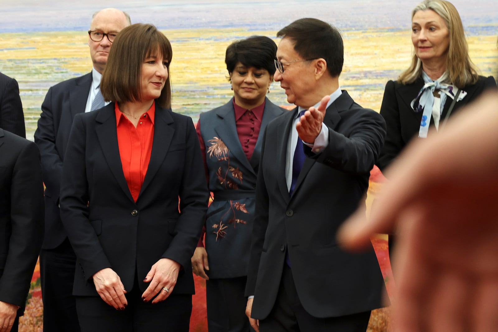 Chinese Vice President Han Zheng gestures to Britain's Chancellor of the Exchequer Rachel Reeves following a photo session at the Great Hall of the People in Beijing, Saturday, Jan. 11, 2025. (Florence Lo/Pool Photo via AP)