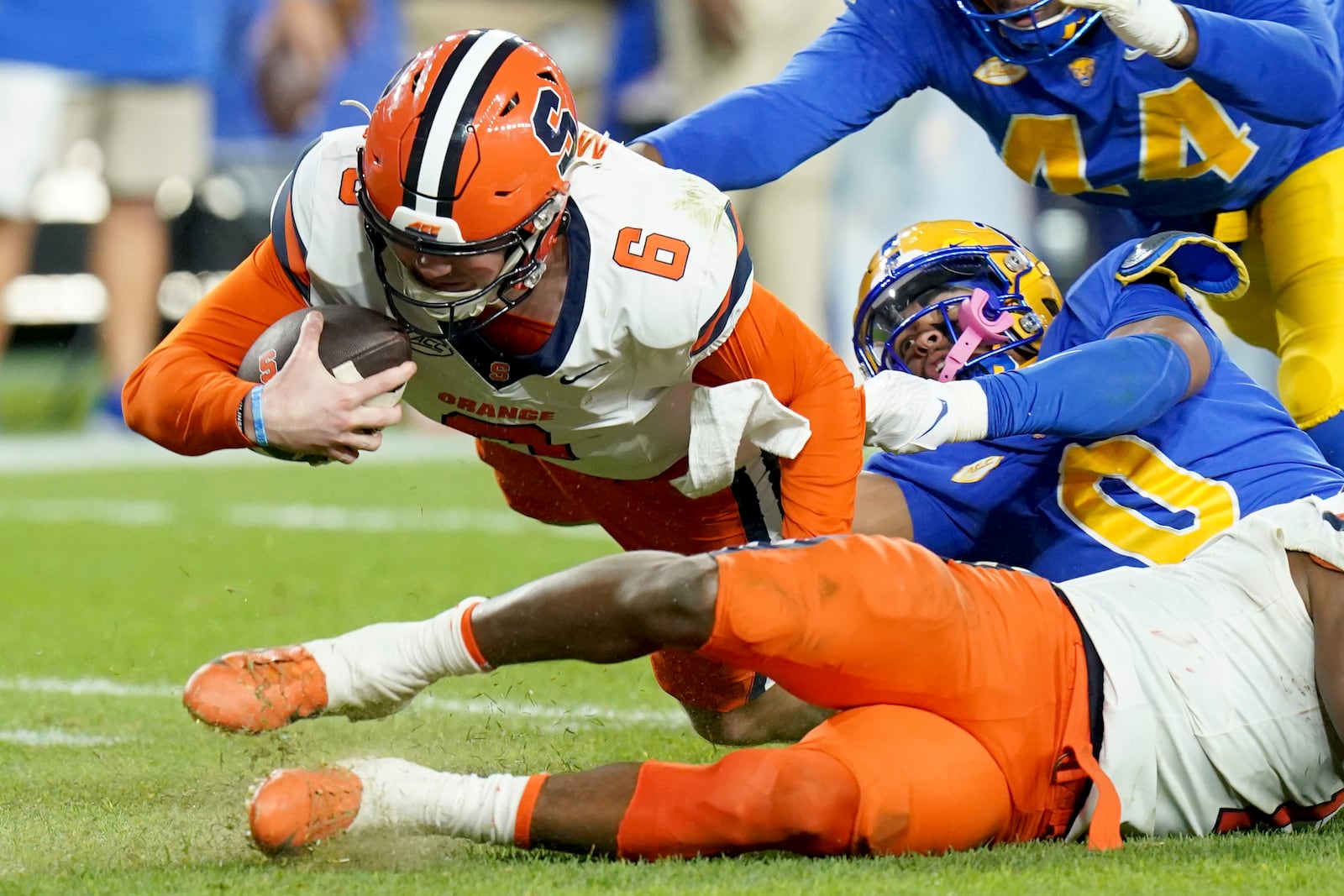 Pittsburgh linebacker Braylan Lovelace (0) sacks Syracuse quarterback Kyle McCord (6) during the first half of an NCAA college football game, Thursday, Oct. 24, 2024, in Pittsburgh. (AP Photo/Matt Freed)