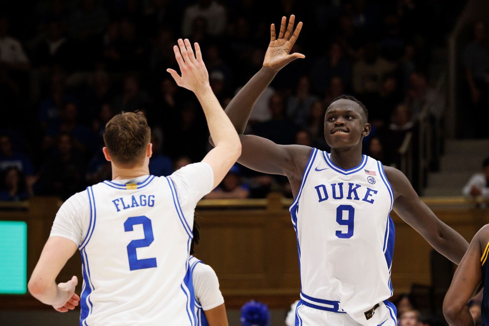 Duke's Khaman Maluach (9) and Cooper Flagg (2) high-five after a play during the second half of an NCAA college basketball game against California in Durham, N.C., Wednesday, Feb. 12, 2025. (AP Photo/Ben McKeown)