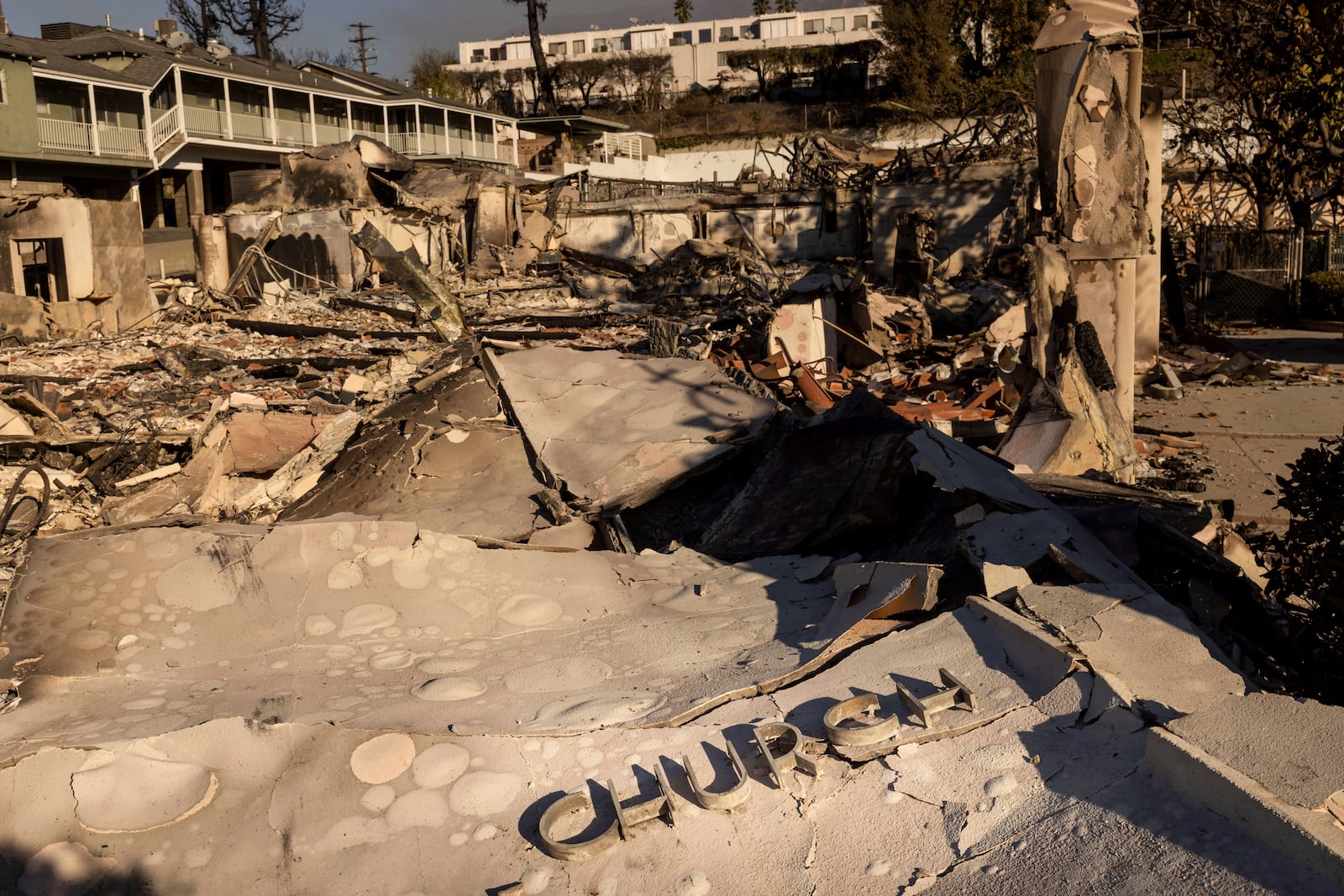 The Altadena Community Church is left damaged by the Eaton Fire Sunday, Jan. 12, 2025 in Altadena, Calif. (AP Photo/Ethan Swope)