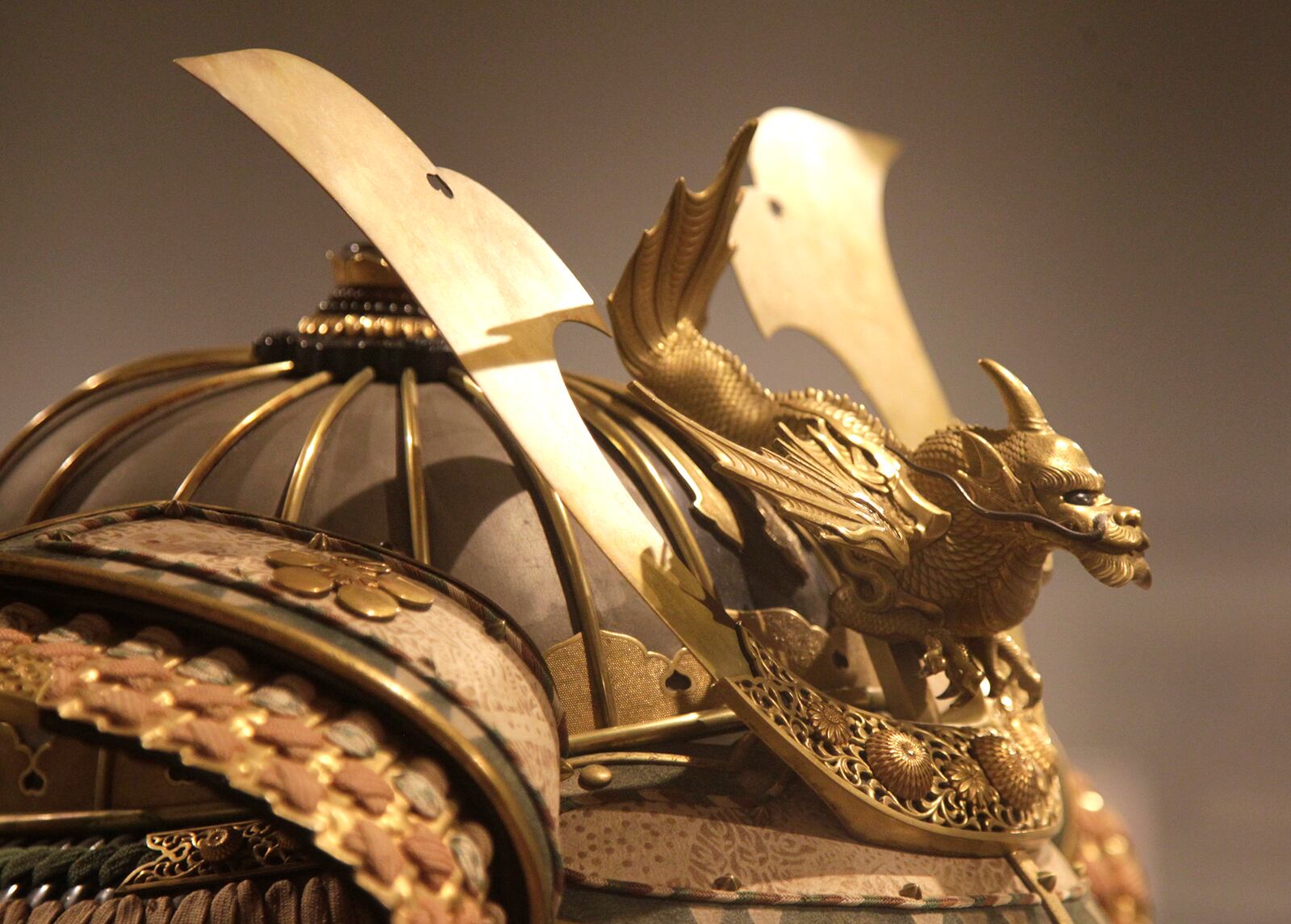 âSamurai, Ghosts and Lovers: Yoshitoshi's Complete 100 Aspects of the Moon,â in on display at the Dayton Art Institute. A flying dragon adorns the helmet that is a part of a set of armor that belonged to Maeda Toshiyasu in 1830.  LISA POWELL / STAFF