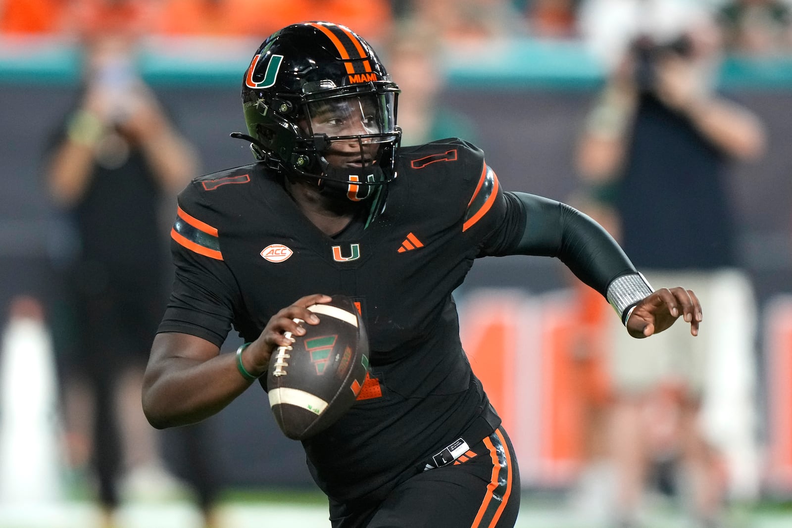 Miami quarterback Cam Ward looks to pass during the first half of an NCAA college football game against Florida State, Saturday, Oct. 26, 2024, in Miami Gardens, Fla. (AP Photo/Lynne Sladky)