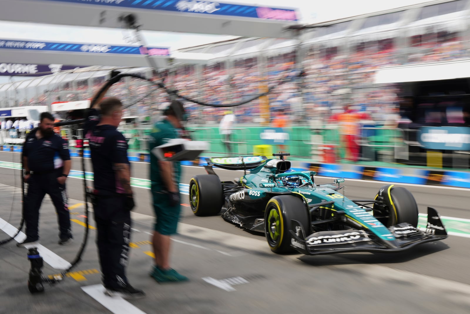 Aston Martin driver Lance Stroll of Canada steers his back to his team garage during the third practice session at the Australian Formula One Grand Prix at Albert Park, in Melbourne, Australia, Saturday, March 15, 2025. (AP Photo/Scott Barbour)