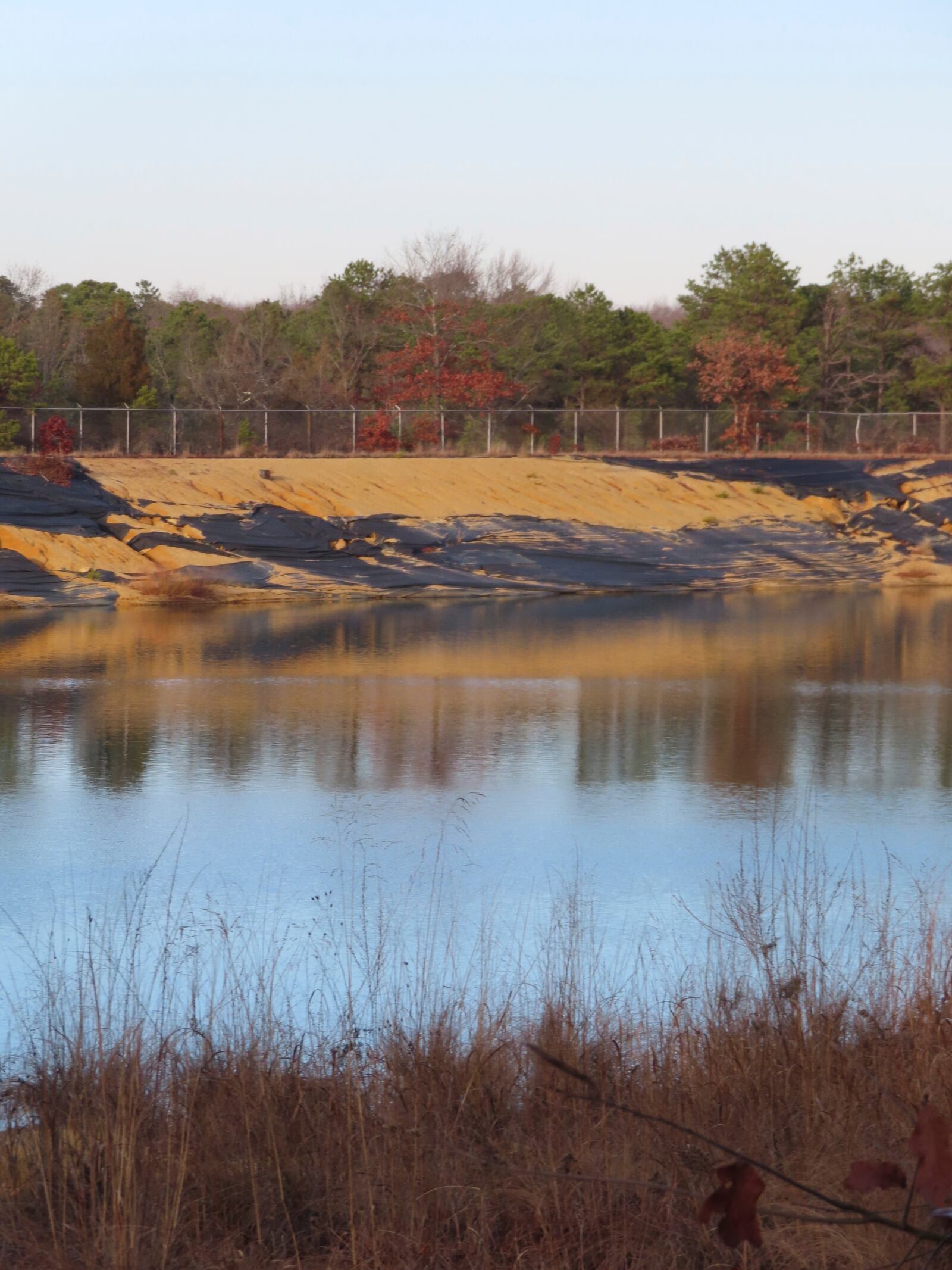 Water sits in a lined pit at the former Ciba-Geigy chemical plant on Dec. 17, 2024, in Toms River, N.J., one of America's most notorious toxic waste sites. (AP Photo/Wayne Parry)