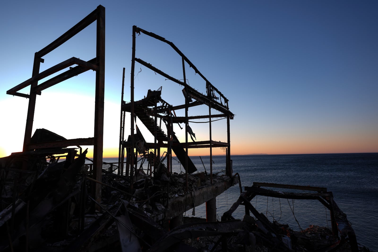 A beach front home destroyed by the Palisades Fire is seen in Malibu, Calif., Wednesday, Jan. 15, 2025. (AP Photo/Jae C. Hong)