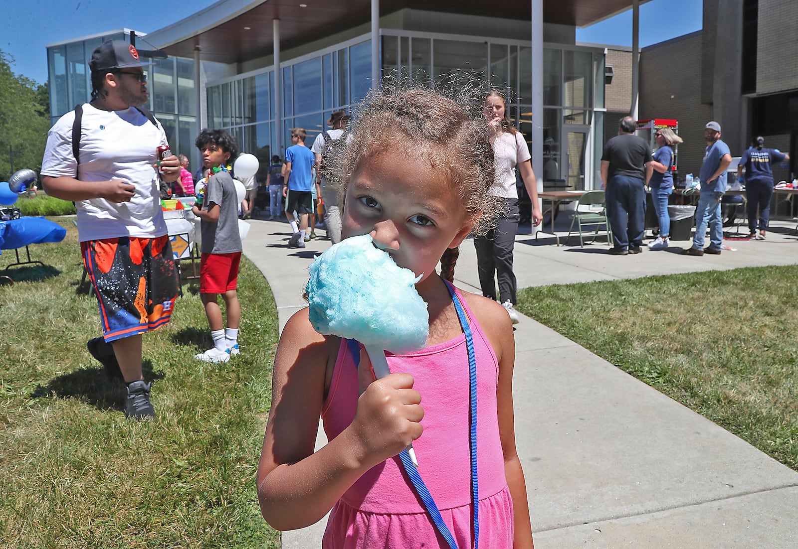 Lennix Watkins enjoys some cotton candy at Clark State College's 60th Anniversary Celebration Thursday, June 30, 2022. BILL LACKEY/STAFF