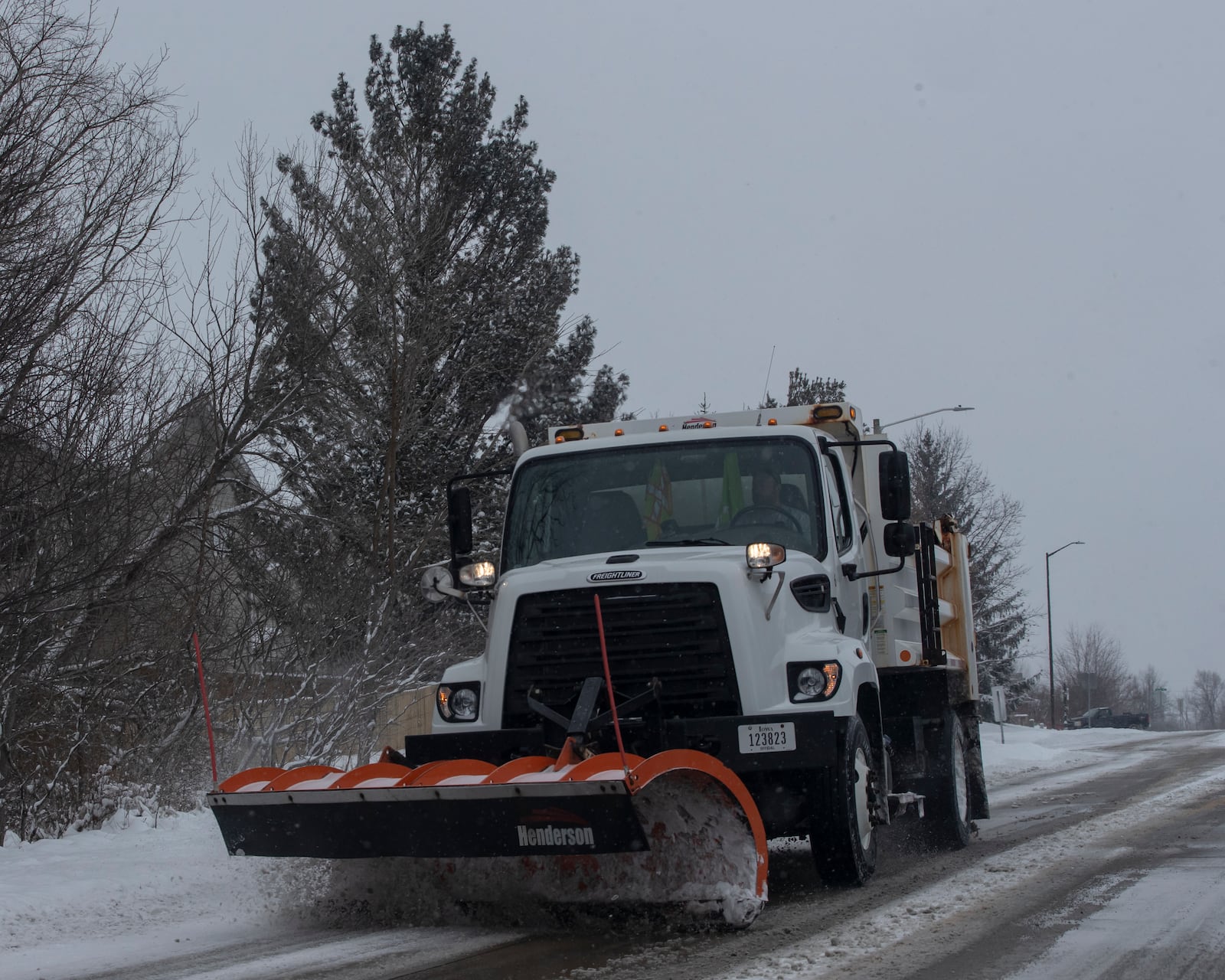 A snowplow clears a roadway in Coralville, Iowa on Wednesday, Feb. 12, 2025. (Nick Rohlman/The Gazette)