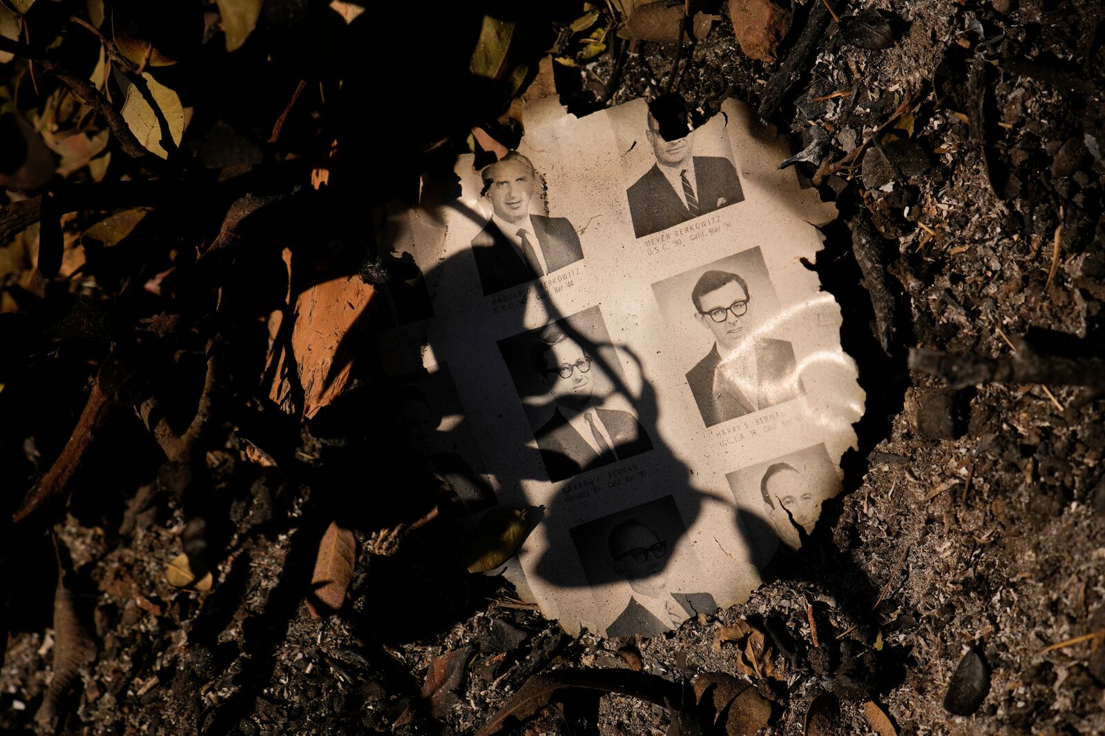 FILE - A partially burned yearbook is seen on the ground in the aftermath of the Palisades Fire in the Pacific Palisades neighborhood of Los Angeles, Monday, Jan. 13, 2025. (AP Photo/John Locher, File)