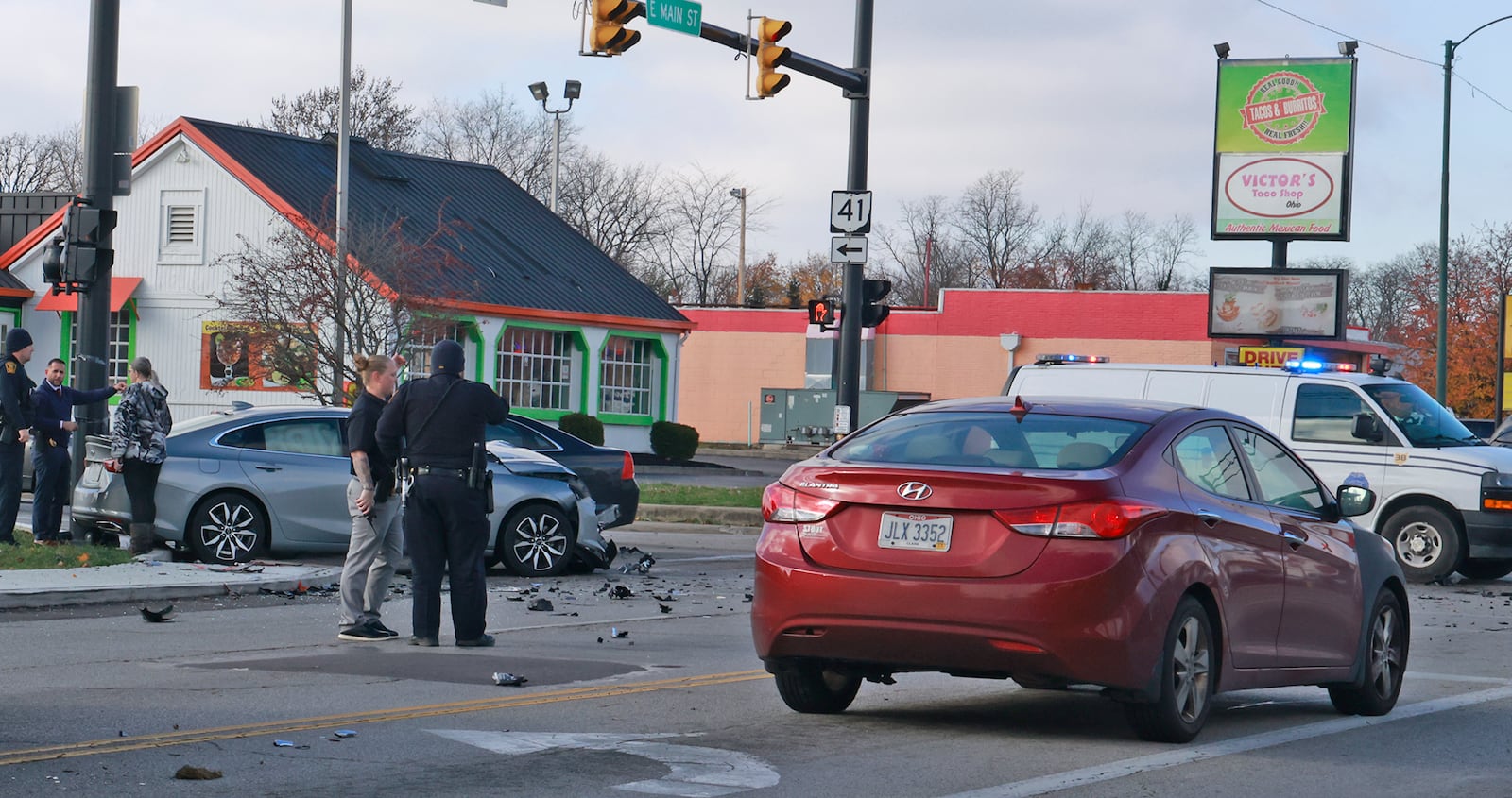 Police investigate the scene at the intersection of Belmont Avenue and East Main Street where a pursuit ended in a multi vehicle crash Tuesday, Nov. 26, 2024. BILL LACKEY/STAFF