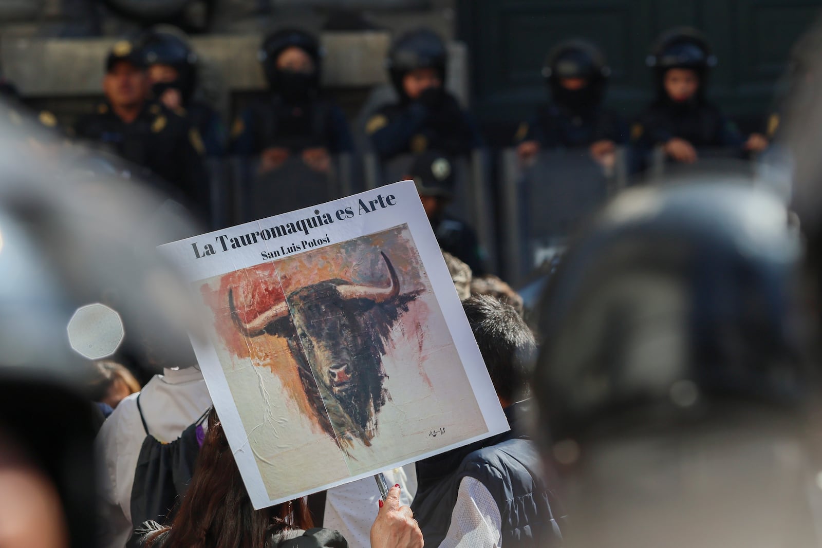 A supporter of bullfighting holds a sign that reads in Spanish "Bullfighting is an art" outside Mexico's City's Congress where lawmakers are expected to debate its continuation in Mexico City, Tuesday, March 18, 2025. (AP Photo/Ginnette Riquelme)