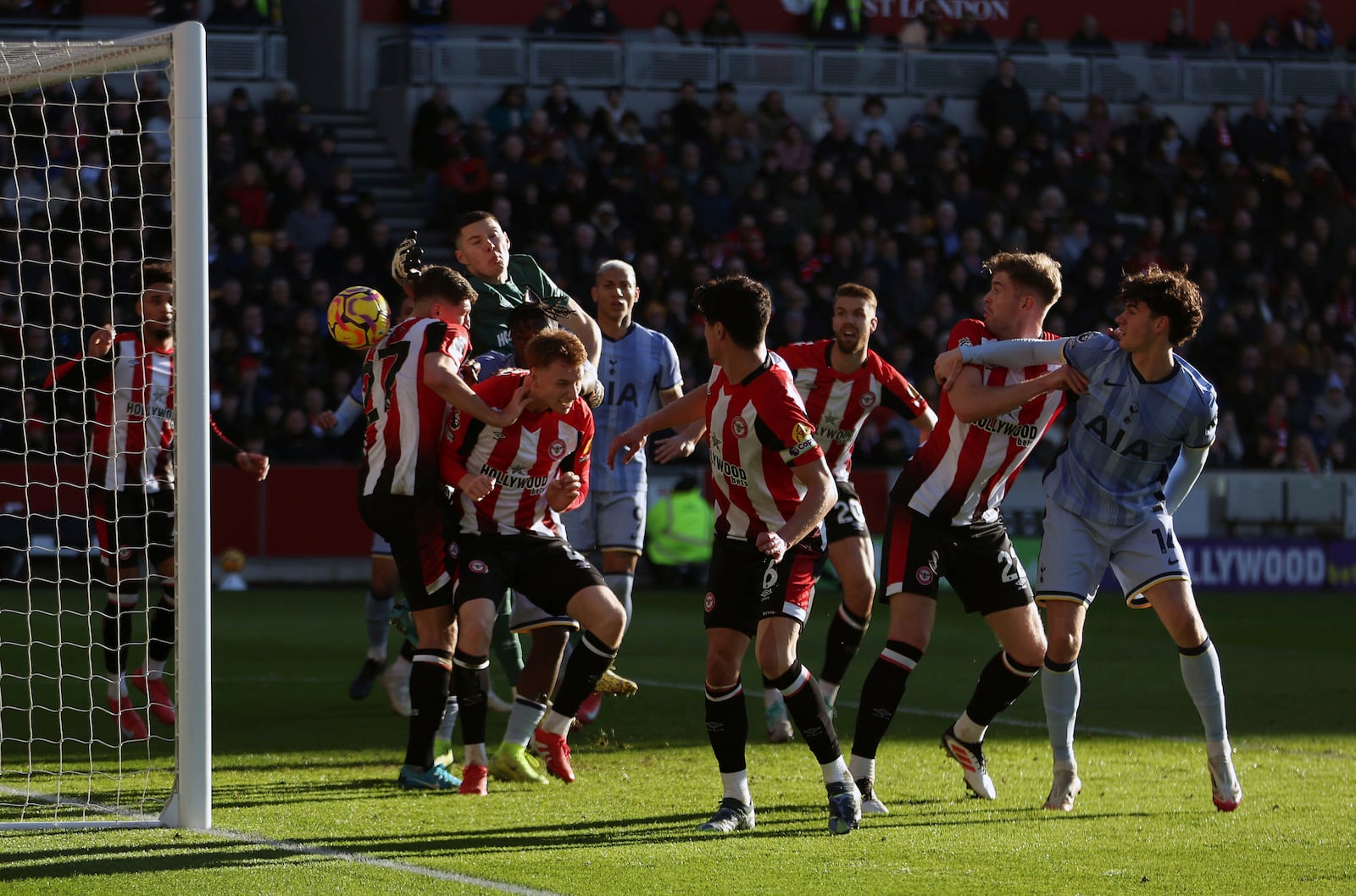 Brentford's Vitaly Janelt, left no. 27, scores an own goal during the English Premier League soccer match between Brentford and Tottenham Hotspur at the Gtech Community Stadium, London, Sunday Feb. 2, 2025. (Steven Paston/PA via AP)