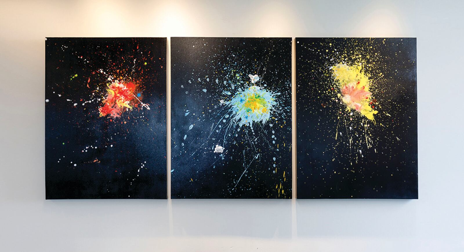 Artist Ron Rollins was inspired by the DAI's French painting, "Dinner at the Casino," a depiction of erupting fireworks. His three-panel painting, "And Then the Rockets Traced the Edges of the Night," suggests "how the library contains explosions of ideas for all to discover."