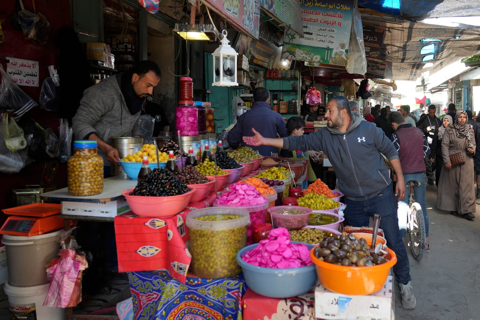 Palestinians shop for provisions ahead of the start of the Muslim holy month of Ramadan in Gaza City, Gaza Strip, Friday, Feb. 28, 2025. (AP Photo/Abdel Kareem Hana)