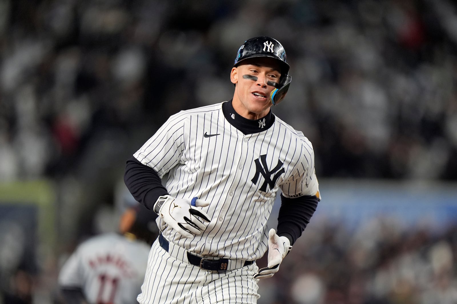 New York Yankees' Aaron Judge runs the bases after hitting a two-run home run against the Cleveland Guardians during the seventh inning in Game 2 of the baseball AL Championship Series Tuesday, Oct. 15, 2024, in New York. (AP Photo/Frank Franklin II)