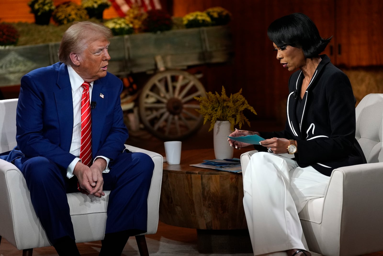 Republican presidential nominee former President Donald Trump speaks during a break in a Fox News town hall with Harris Faulkner at The Reid Barn, Tuesday, Oct. 15, 2024, in Cumming, Ga. (AP Photo/Julia Demaree Nikhinson)