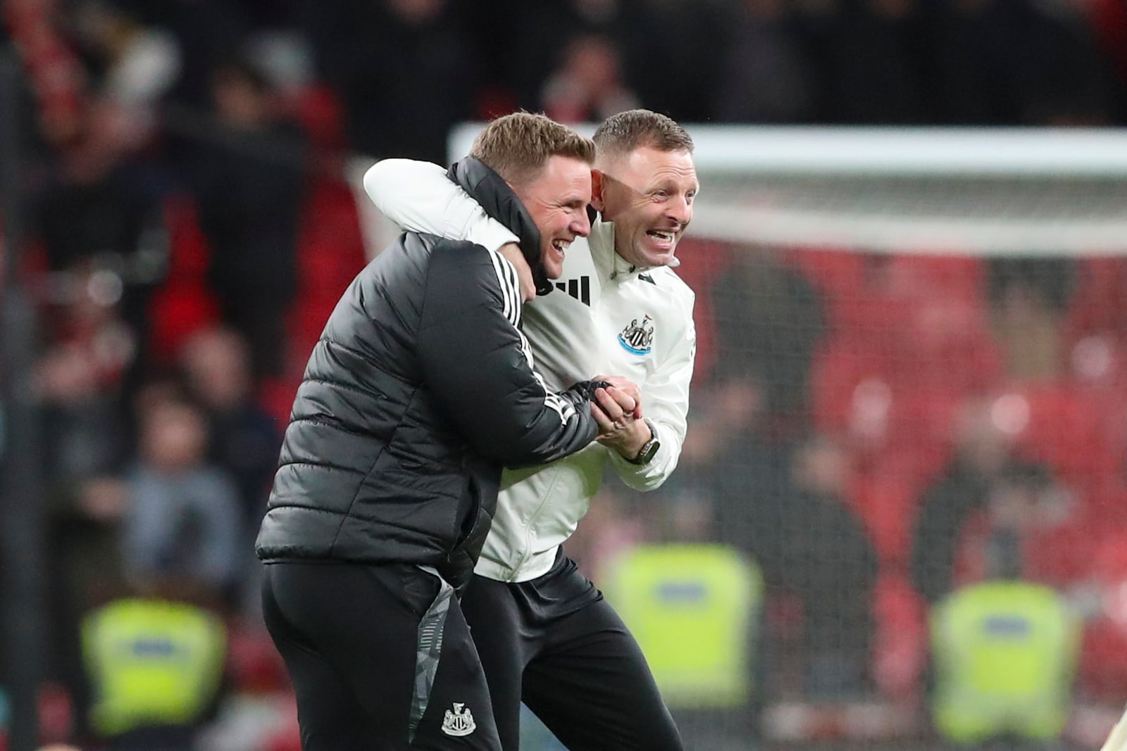 Newcastle's head coach Eddie Howe, front, celebrates at the end of the EFL Cup final soccer match between Liverpool and Newcastle at Wembley Stadium in London, Sunday, March 16, 2025. (AP Photo/Scott Heppell)