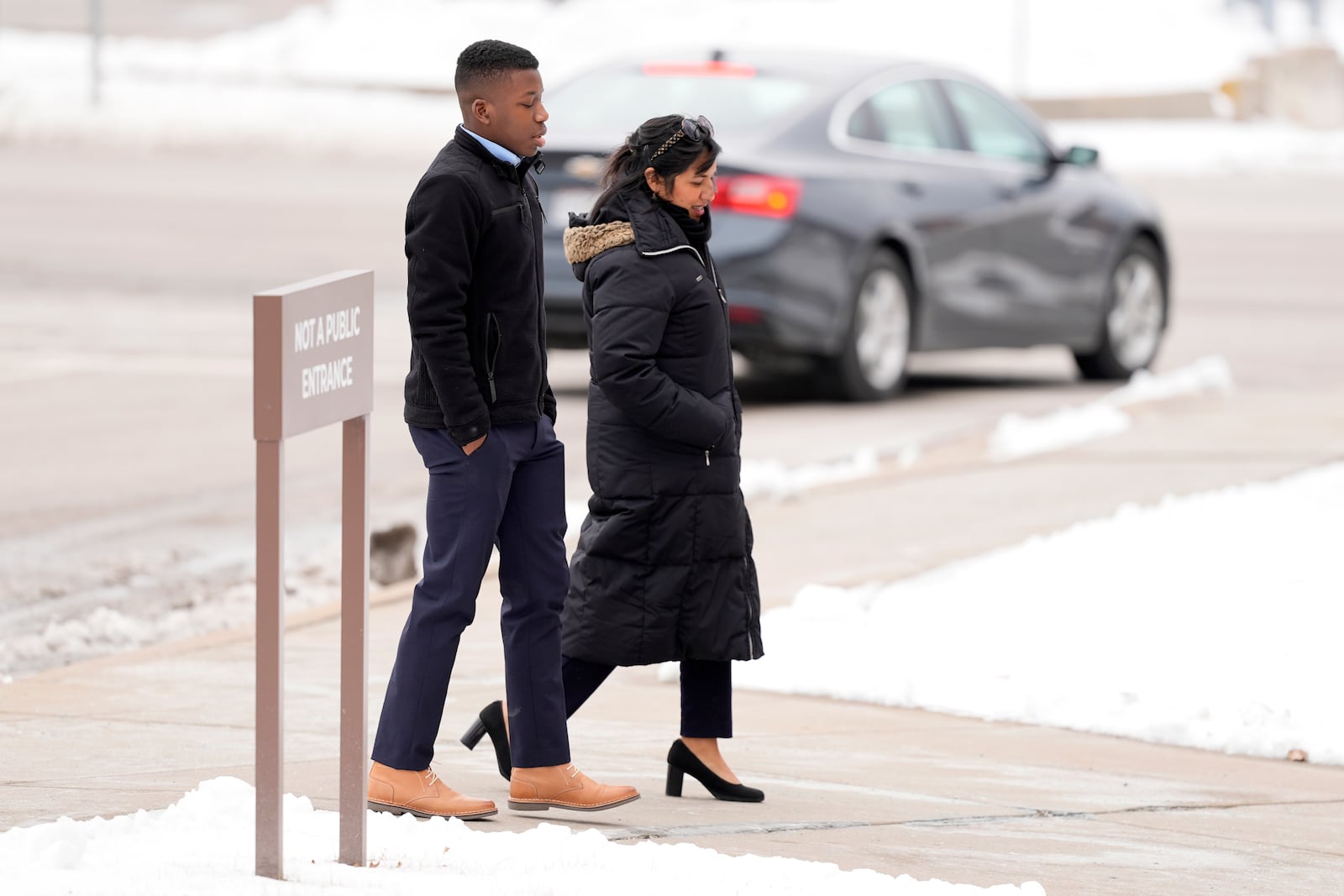 Ralph Yarl walks to the Clay County Courthouse to attend a hearing for Andrew Lester, who pleaded guilty in charges stemming from a 2023 incident when Lester shot Yarl in the head after Yarl mistakenly knocked on the Lester's door, Friday, Feb. 14, 2025, in Liberty, Mo. (AP Photo/Charlie Riedel)