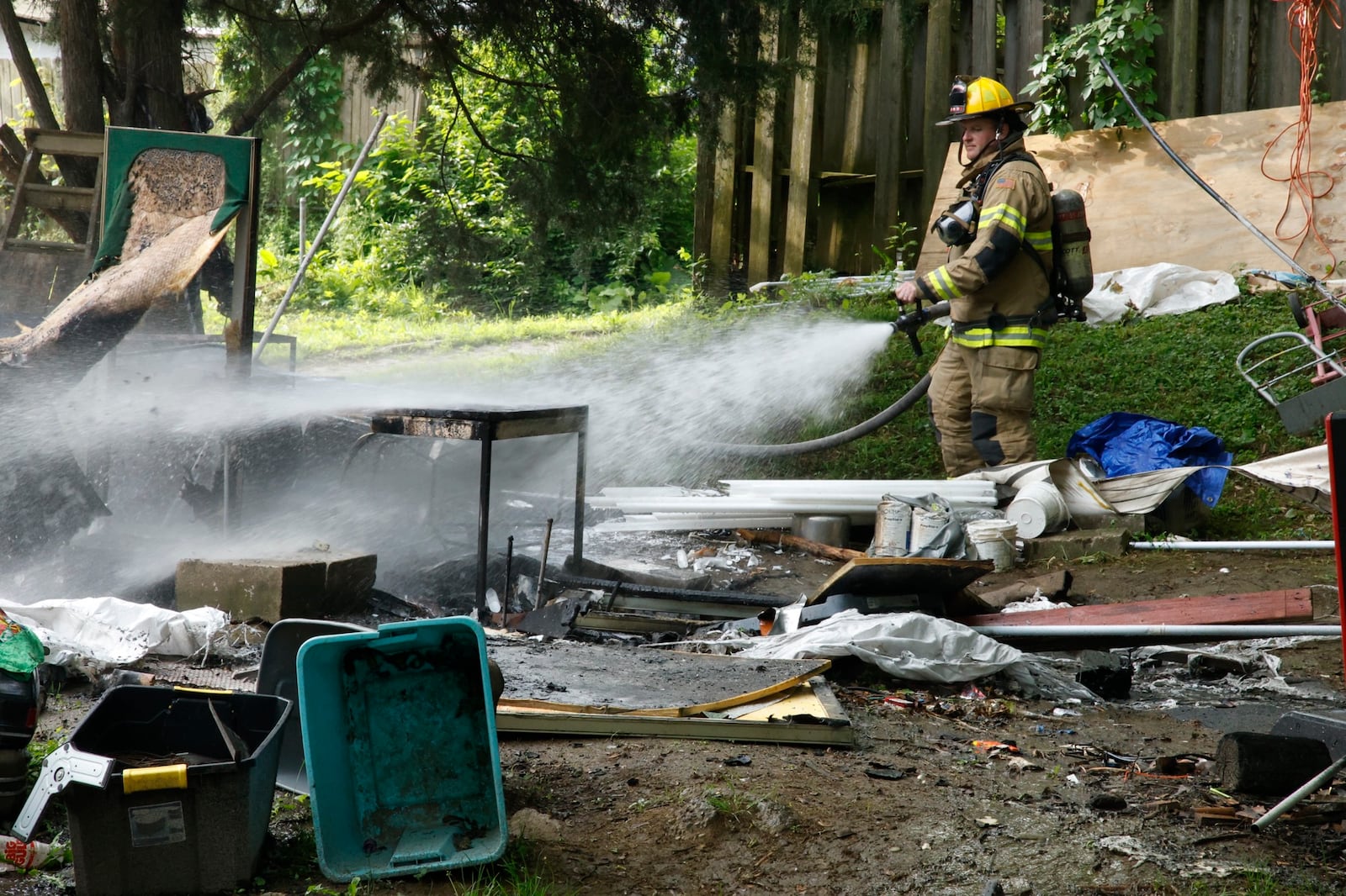 The Springfield Fire and Rescue Division responded to reports of a working fire in an alley between Highland Avenue and Warder Street Tuesday morning May 21, 2024. Black smoke could be seen across the city. The fire was quickly contained and appeared to be in a homeless encampment. There were no injuries reported. BILL LACKEY/STAFF