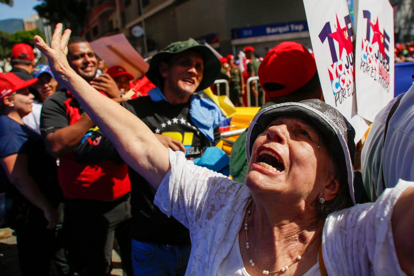 Government supporters gather outside the National Assembly during the swearing-in ceremony for Venezuelan President Nicolas Maduro for a third term in Caracas, Venezuela, Friday, Jan. 10, 2025. (AP Photo/Cristian Hernandez)