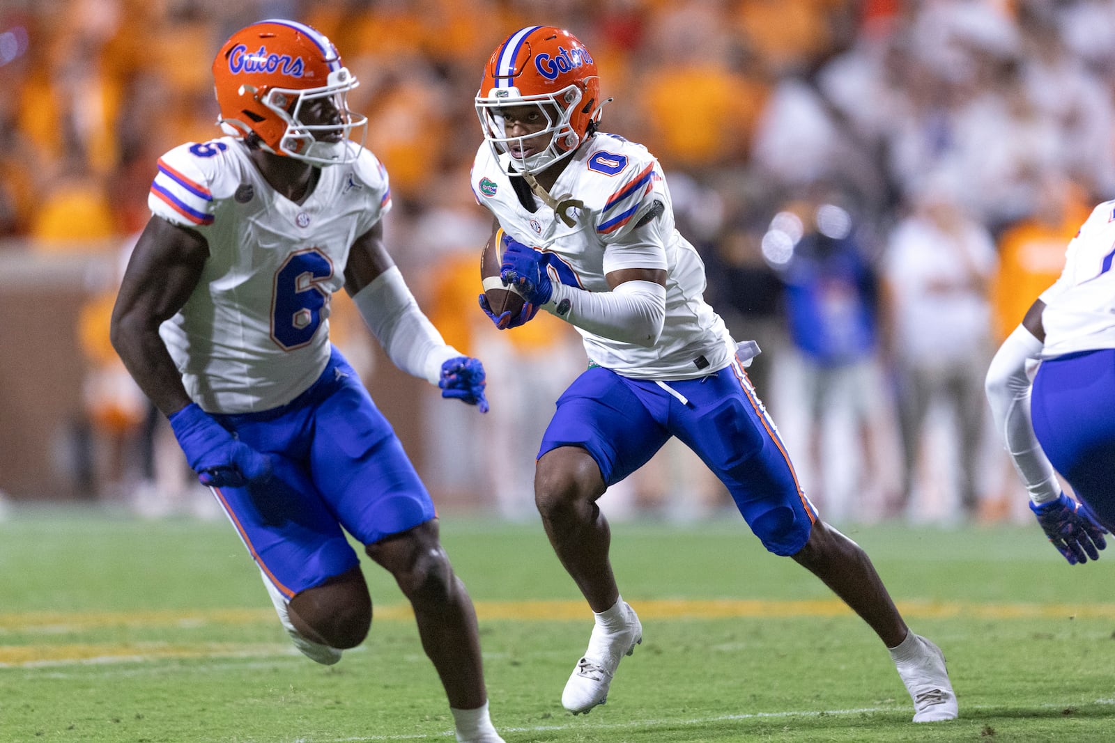 Florida defensive back Sharif Denson (0) returns an interception during the first half of an NCAA college football game against Tennessee, Saturday, Oct. 12, 2024, in Knoxville, Tenn. (AP Photo/Wade Payne)