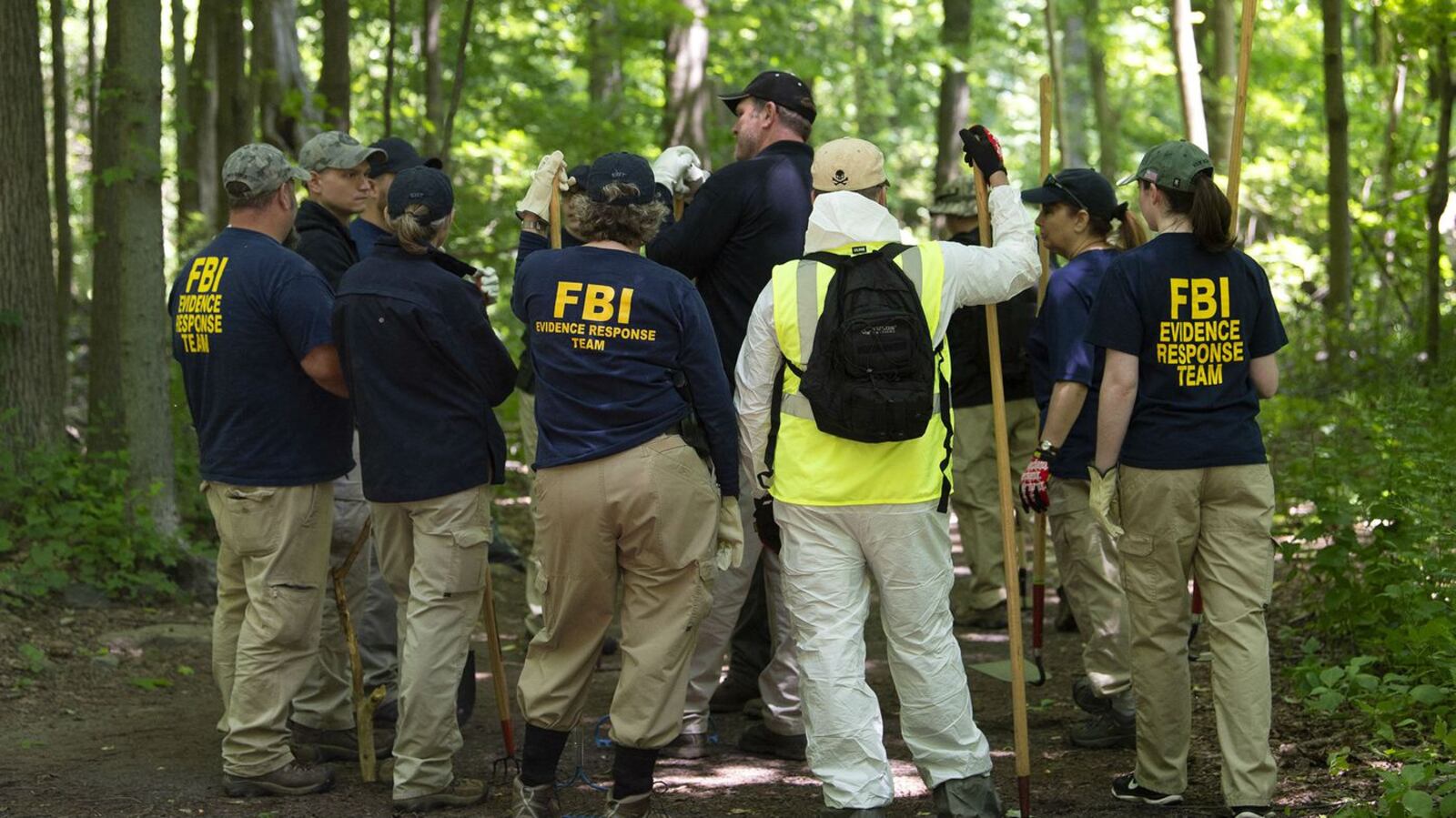 An FBI evidence response team combs a heavily wooded area of Waveny Park in New Canaan, Conn., June 3, 2019, for signs of missing mother Jennifer Dulos, 50, whose vehicle was found abandoned nearby. Dulos' estranged husband, Fotis Dulos, has been charged with murder, felony murder and kidnapping in her presumed death. (Patrick Raycraft/Tribune News Service via Getty Images via Getty Images)