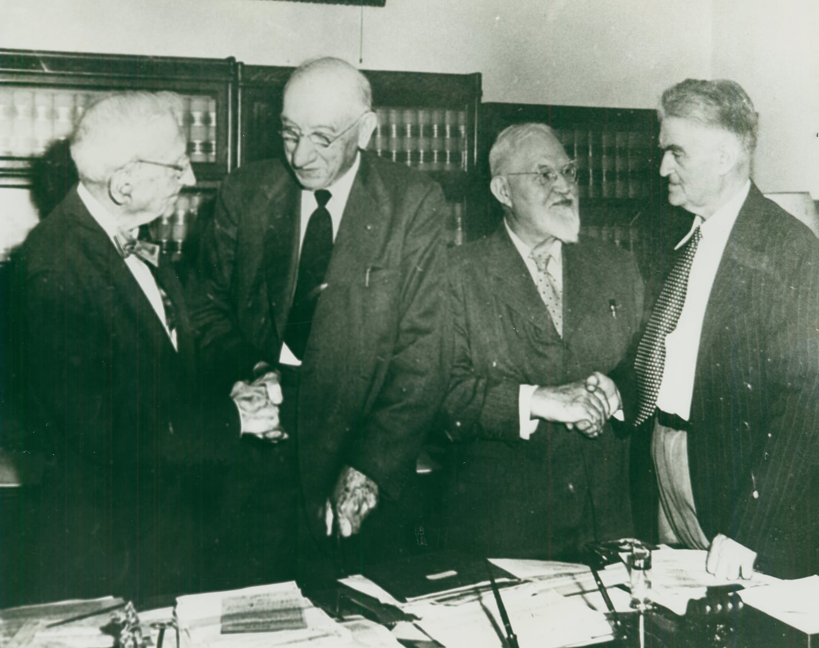 This 1950 photo shows three men on the right who were instrumental in things of local and national importance in history. The man on the far left is unidentified, shaking hands with former teacher and superintendent A.B. Graham, the founder of 4-H, which started an agriculturally based movement which today still offers opportunities to educate, advance, and engage youth. Next to him is George Harrison Shull, a local school teacher and scientist who pioneered developments with hybrid corn. Shull is shaking hands with Orton Rust, historian, author, newspaperman, and president of the Clark County Historical Society who organized ceremonies to recognize Graham and Shull’s work. PHOTO COURTESY OF THE CLARK COUNTY HISTORICAL SOCIETY