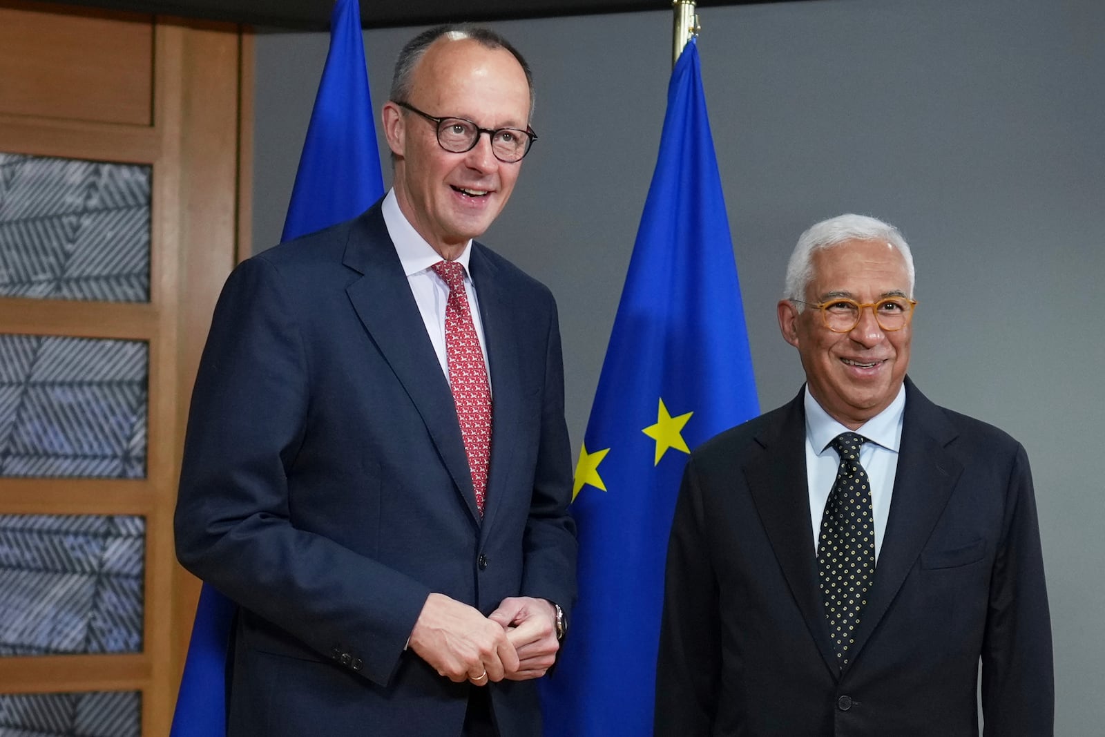 European Council President Antonio Costa, right, greets Friedrich Merz, leader of the Christian Democratic Union, prior to a meeting at the European Council building in Brussels, Thursday, March 6, 2025. (AP Photo/Virginia Mayo)