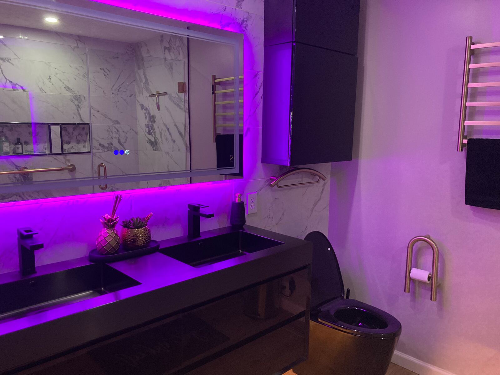 A “floating” dual-sink counter, which complements the new cabinets above the toilet and in the corner nook, has a deceptively large amount of room for bathroom essentials. Contributed photo by Sarah Franks Fries