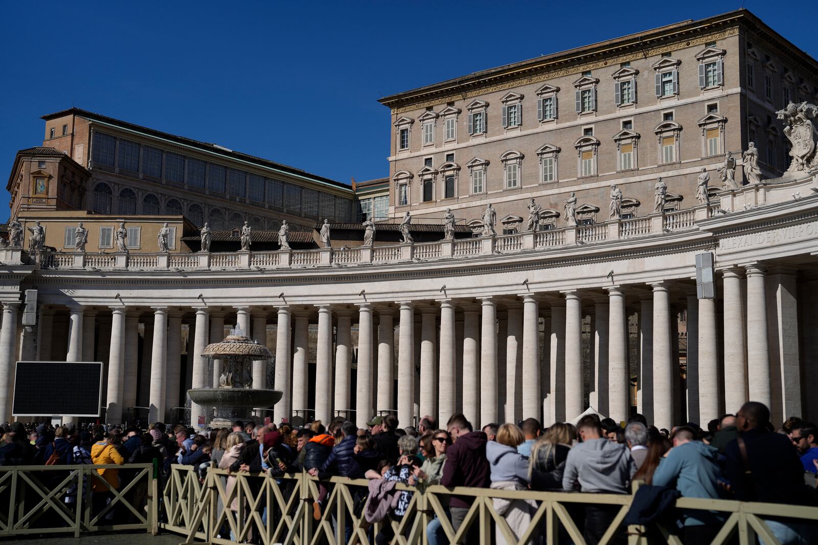 Faithful wait under the closed window of the Apostolic Palace at The Vatican, Sunday, Feb. 16, 2025, from where Pope Francis, who was hospitalised on Friday, blesses the faithful gathered in St. Peter's Square after the Angelus every Sunday. (AP Photo/Gregorio Borgia)