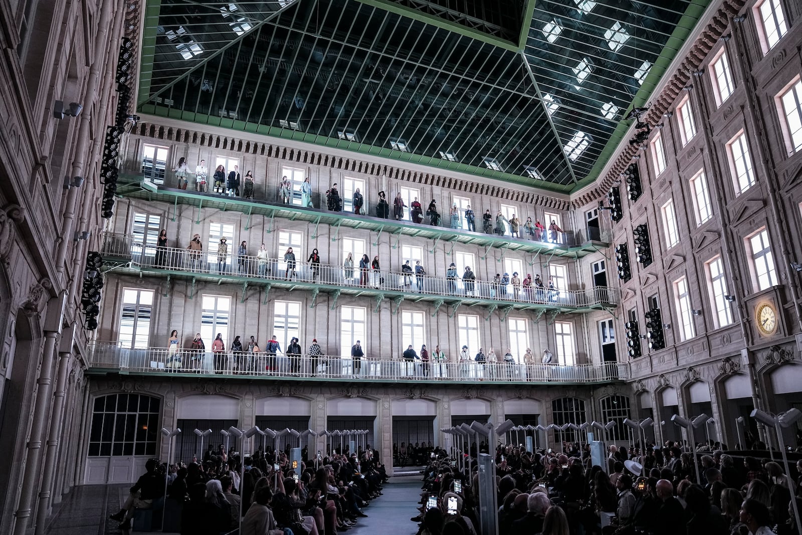 A general view of models on various balconies, wearing creations as part of the Louis Vuitton Fall/Winter 2025-2026 Womenswear collection presented in Paris, Monday, March 10, 2025. (Photo by Scott A Garfitt/Invision/AP)