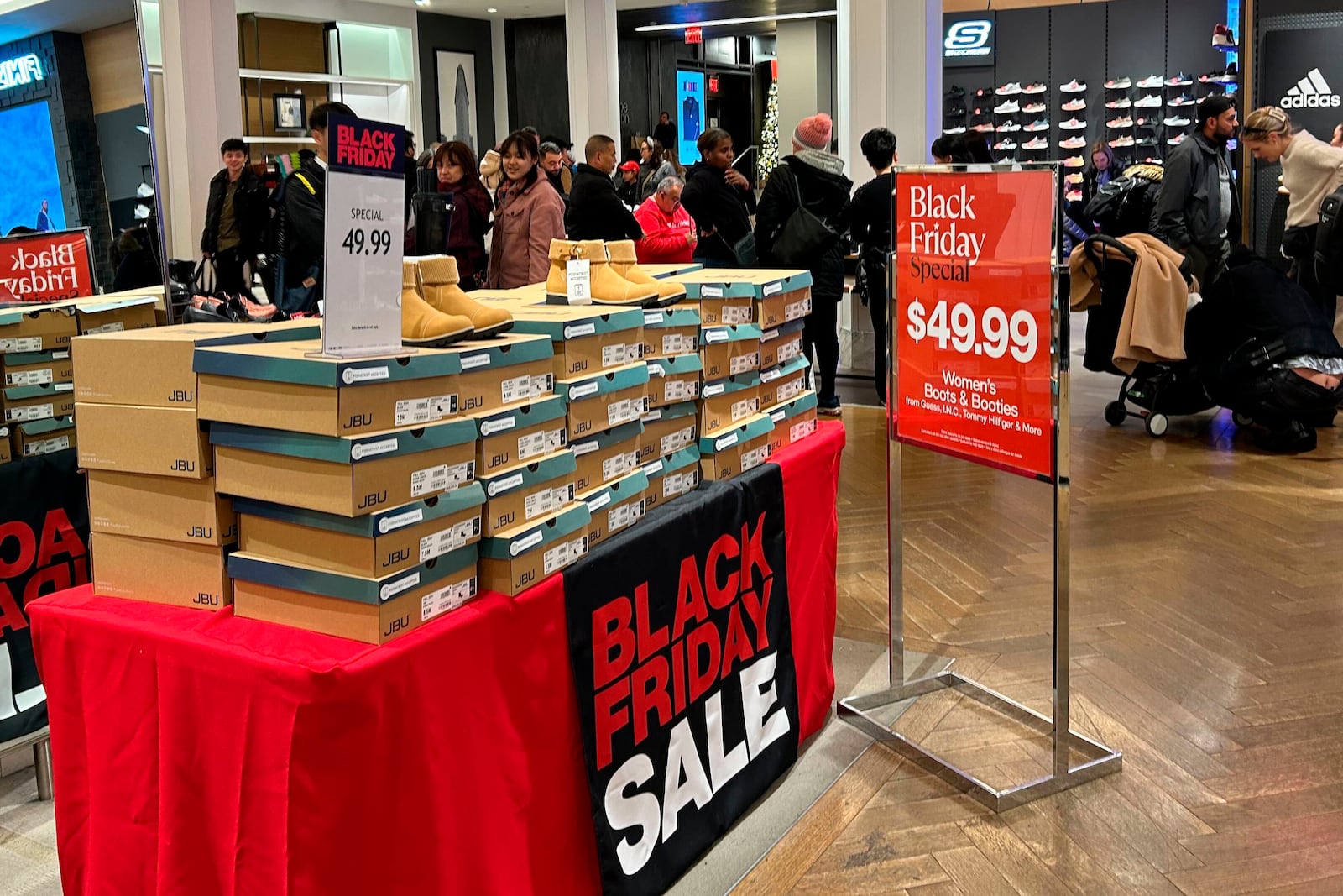 Items on sale for Black Friday are displayed at Macy's department store on Sunday, Nov. 24, 2024, in New York. (AP Photo/Anne D'Innocenzio)