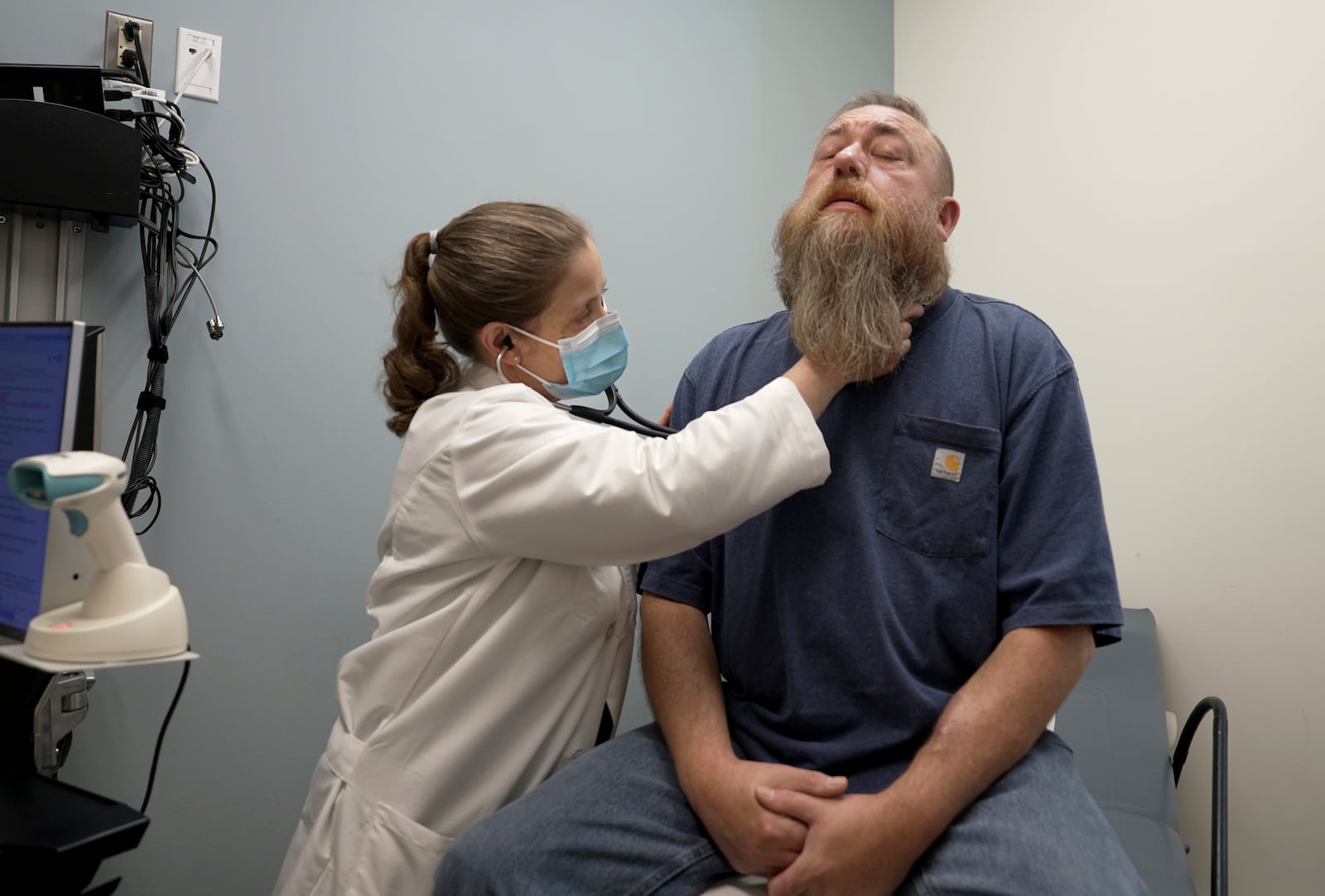 Dr. Silke Niederhaus exams patient Eric Lyons at the University of Maryland in Baltimore, Md., on May 13, 2024. (AP Photo/Shelby Lum)