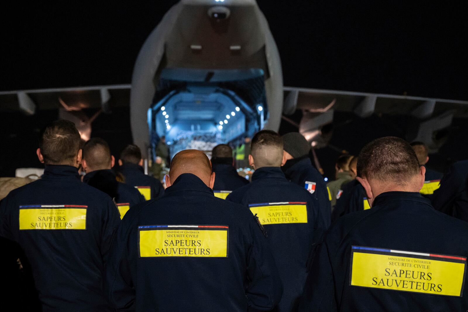 This photo provided Sunday Dec.15, 2024 by the French Army shows rescue workers before boarding a military plane for the island of Mayotte, in the Indian Ocean, after cyclone Chido caused extensive damage with reports of several fatalities, Saturday Dec.14, 2024 in Orleans, central France. (Laure-Anne Maucorps/ Etat Major des Armées via AP)