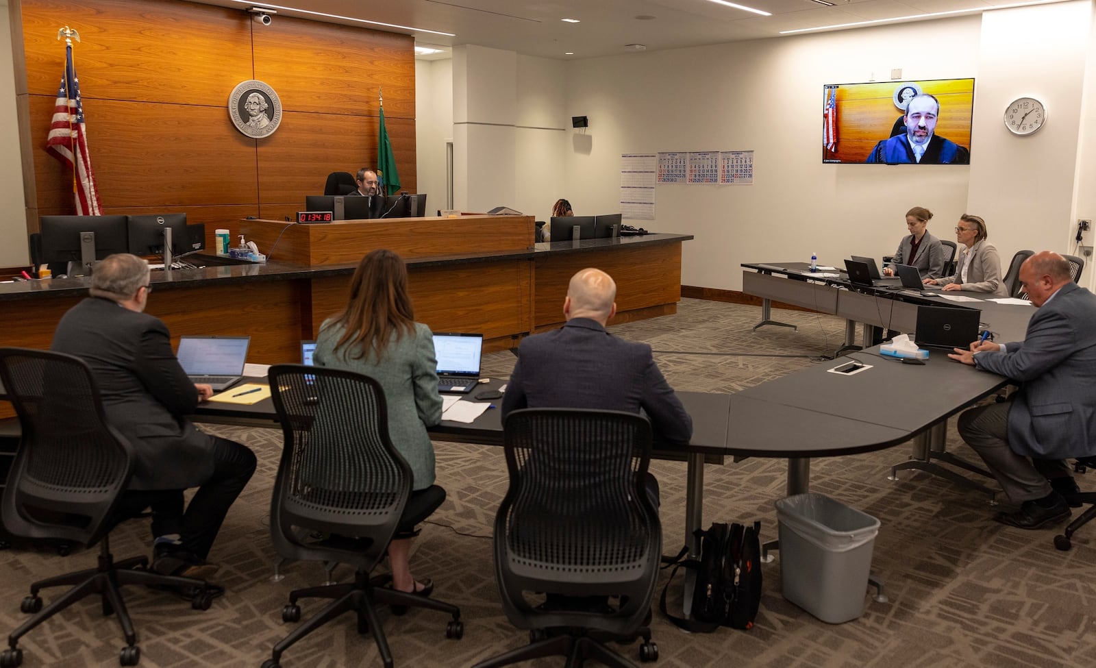 King County Superior Court Judge Joe Campagna, top left, speaks during a preliminary hearing for a suspect in the shooting deaths of five people at a home in Fall City, at the Clark Child and Family Justice Center, Tuesday, Oct. 22, 2024, in Seattle. (Nick Wagner/The Seattle Times via AP, File)