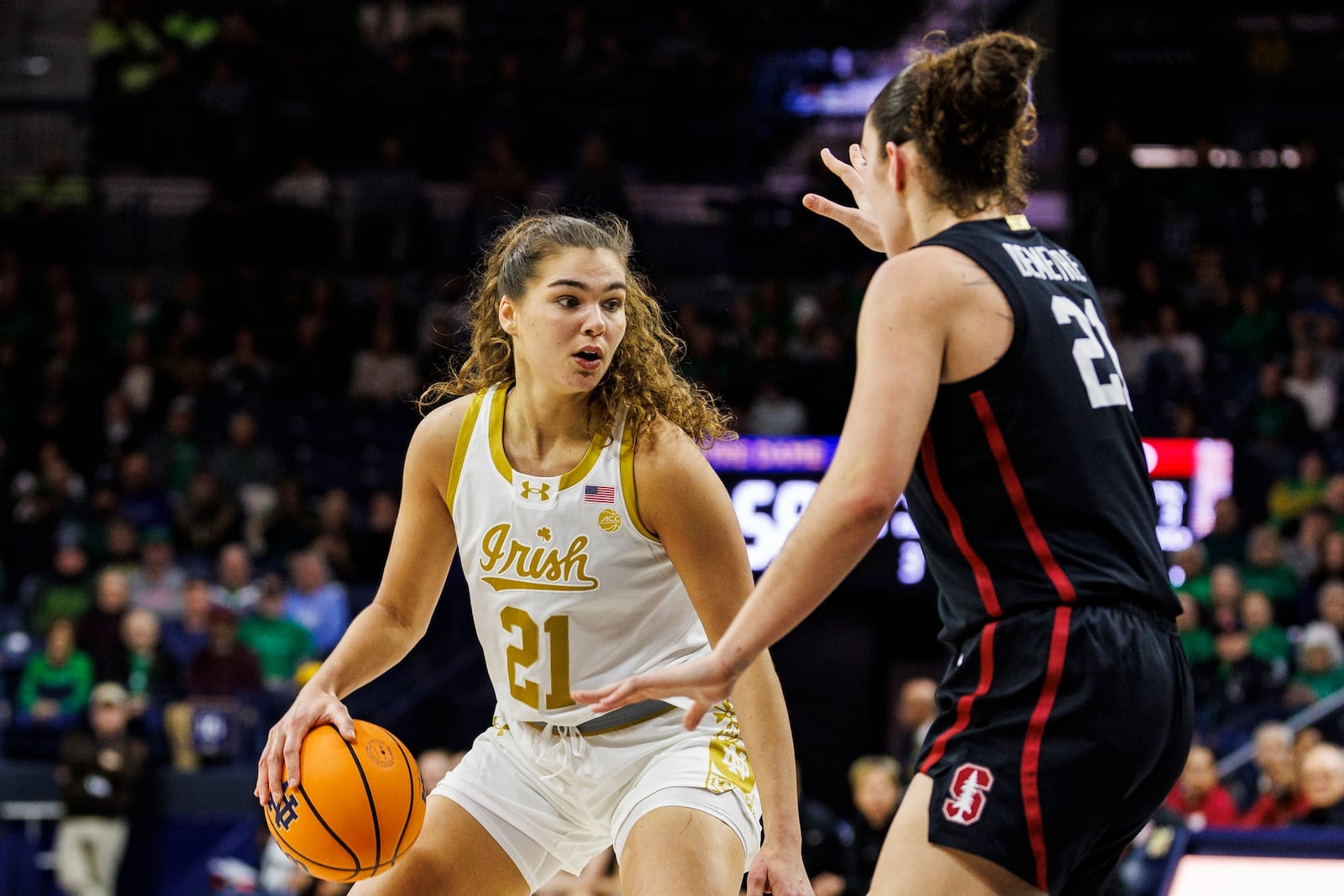 Notre Dame forward Maddy Westbeld (21) looks to pass as Stanford forward Brooke Demetre (21) defends during the second half of an NCAA college basketball game Thursday, Feb. 6, 2025, in South Bend, Ind. (AP Photo/John Mersits)