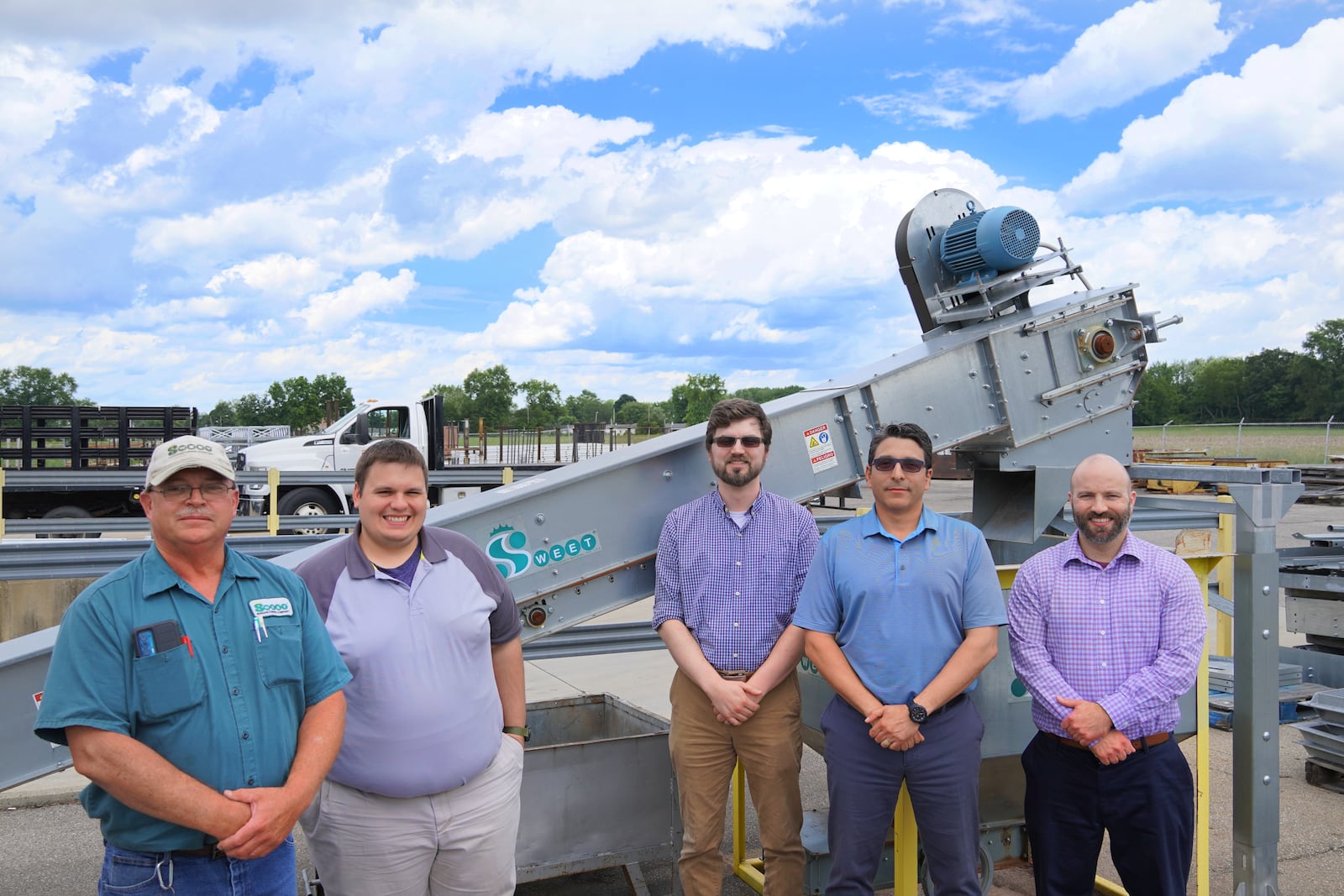 Sweet Manufacturing Company in Springfield has been awarded the Ohio New Product Award for its low profile conveyor. In this photo are the main people involved including (from left to right) Darrell Smith, Tyler Knoblauch, Mikal Shorts, Julio Contreras and Chris Smith, with the new product. Contributed