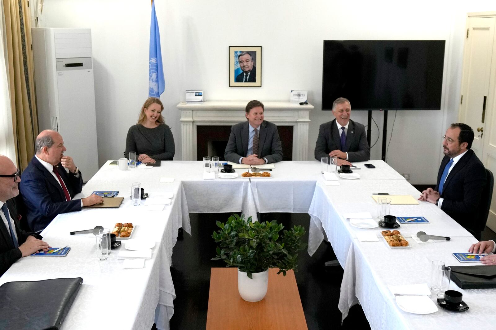 United Nations Chief of Mission in Cyprus Colin Stewart, center, hosts a meeting between the ethnically divided island nation's Greek Cypriot President Nikos Christodoulides, right, and the leader of the breakaway Turkish Cypriots Ersin Tatar, second left, at the U.N. official's residence inside a U.N.-controlled buffer zone cutting across the divided capital Nicosia, Cyprus, Monday, Jan. 20, 2025. (AP Photo/Petros Karadjias)